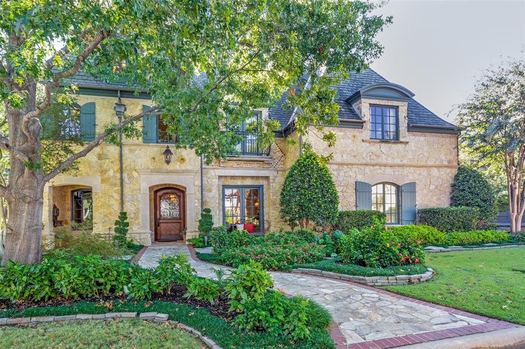 Join us for an open house Sunday 1-3 at this beautifully designed custom home, featured in three publications, nestled on a prime corner lot in a serene, wooded area surrounded by mature trees and picturesque creeks. Enjoy 24-hour gated security with a sense of acreage and privacy without the upkeep. Landscaping boasts tiered patios, fountains, stone steps, and winding paths—perfect for entertaining. With ample parking, guests are always welcome.  Inside, convenience meets luxury with an elevator and secondary staircase leading to the expansive primary wing featuring his and her bathrooms and closets, a workout room, a luggage closet, and a balcony overlooking the peaceful creek.  Storage is extraordinary, including an oversized walk-in attic with built-in shelving plus multiple large interior closets not dedicated to bedrooms. Every detail was considered in this custom home, including soaring beams and trusses, elevated ceilings, and repurposed antique doors in the hall, pantry, and elevator. The spacious downstairs guest suite offers wider doorways, ideal for multi-generational living.The gourmet kitchen offers additional walk-in storage and a shelved gift-wrapping area, while the office showcases hand-painted beams and a large walk-in storage closet. The multi-use media room has been recently updated with a modern projector and sound system.  Directly across the street from Glen Abbey fitness amenity.  Expansive exterior lighting allows year-round use of outdoor space.  Roof replaced December 2024, Generac Generator 2022, Extra Insulation for high-efficiency.  Sellers are open to including many of the furnishings for the Buyers as part of the sale if of interest.  Reach out for a full list of special features, 3D tour, and to schedule a tour today!
