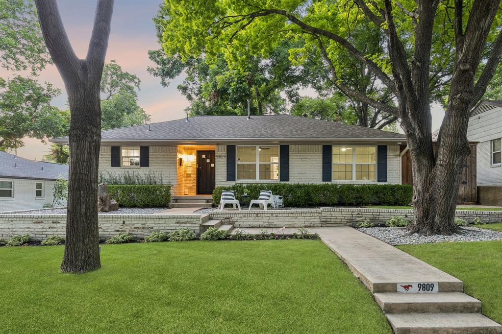 Nestled beneath a canopy of mature trees in the highly sought-after Lakeridge Estates of Lake Highlands, this beautiful home is decked out with today's most desirable luxury upgrades. The light-filled interior showcases rich hardwood flooring, fresh designer paint + an open-concept floorplan designed for both entertaining & daily life. At the heart of the home, the stunning chef's kitchen features custom cabinetry, premium SS apps, abundant storage & an impressive marble island that seamlessly connects to the spacious living & dining areas. Large picture windows frame the beautifully landscaped backyard. Beyond its beautiful finishes, this home offers an extraordinary collection of premium systems rarely found at this price point. Enjoy year-round comfort w-a Lennox HVAC system paired with a Lennox PureAir whole-home air purification system, a tankless water heater, LED lighting, Culligan whole-home water softener with multi-stage filtration, whole-house surge protection & the confidence of a Generac whole-home generator that powers both the home & detached garage. Detached 2 car garage is a true standout, thoughtfully transformed into a climate-controlled workspace complete with spray foam insulation, a mini-split HVAC system, custom Baldhead built-in cabinetry, flake epoxy flooring, slat wall organization, overhead bike storage, and a Tesla EV charging station, creating the perfect environment for hobbyists or anyone needing exceptional storage & workspace. Outside, the private backyard has been designed as an extension of the home, featuring lush landscaping, a fully sprinklered yard, an expansive patio, an inviting natural gas fireplace, an automated Mosquito Nix misting system + an 8-ft BOB privacy fence with a secure electric driveway gate. Integrated smart home technology includes exterior security cameras, a LiftMaster MyQ smart gate & garage system + comprehensive security monitoring for added peace of mind. Just minutes from White Rock Lake!