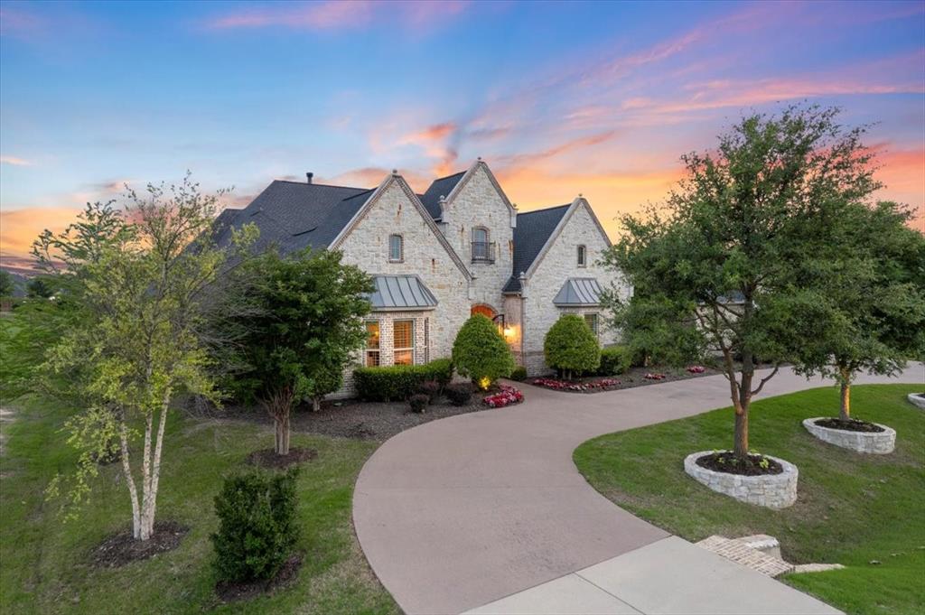Prosper's Crown Jewel Dave R Williams custom home situated on nearly an acre of beautiful, tree-filled lot. One-story flrpln includes a front courtyard, attached Casita w a private entry & a full kitchenette. Open concept w stunning foyer, home office, elegant dining rm, vaulted fam rm with a FTC stone FP. Chef's kit comes w full line of Wolf-Subzero appls, dbl oven & com gas cooktop, granite ctops, brkfst bar, roomy nook, custom white cabs, butler pantry, large pantry. Master retreat has a sitting area, luxurious bathroom w his & her closets, marble vanities, large shower & floating tub, all bdrms w en-suite & one with a Murphy bed. Awesome media rm has a b-in media ctr & barn door. Your private resort w a complete backyard paradise, pool, spa, firepit, outdoor kitchen w a grill, fridge, fireplace, amazing veranda w motorized screens & plenty of yard for tennis-pickleball court. Two mud rms, wet bar w a b-in wine fridge, 4 oversized garages, ex-large laundry rm & plantation shutters.