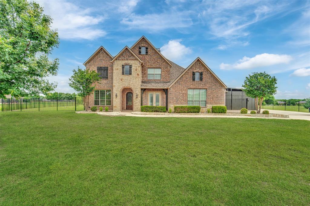 Situated on a beautifully landscaped 1.5-acre lot with HOA-approved RV parking and the tallest iron fence gate in the highly sought-after Lovejoy Independent School District, this stunning home offers exceptional curb appeal and plenty of space for entertaining family and friends.
The chef’s kitchen is a true showpiece, featuring a 6-burner gas cooktop, double ovens, wine fridge, oversized island, walk-in pantry, and wet bar. A private downstairs office is perfect for working from home, while the second downstairs bedroom offers flexibility as a nursery, guest suite, second office, or mother-in-law suite.
The luxurious primary retreat features a spa-like en suite bath with separate vanities, a soaking tub, separate shower, and an incredible oversized closet you truly have to see to believe. Upstairs, you’ll find two additional bedrooms, a spacious game room, dry bar with beverage fridge, and a media room wired for the big screen.
Additional highlights include abundant storage throughout, added concrete surrounding the home, retractable patio shades for year-round outdoor enjoyment, and an outdoor playground that will convey with the property.
This exceptional property truly has it all — luxury, functionality, and room to enjoy both inside and out!