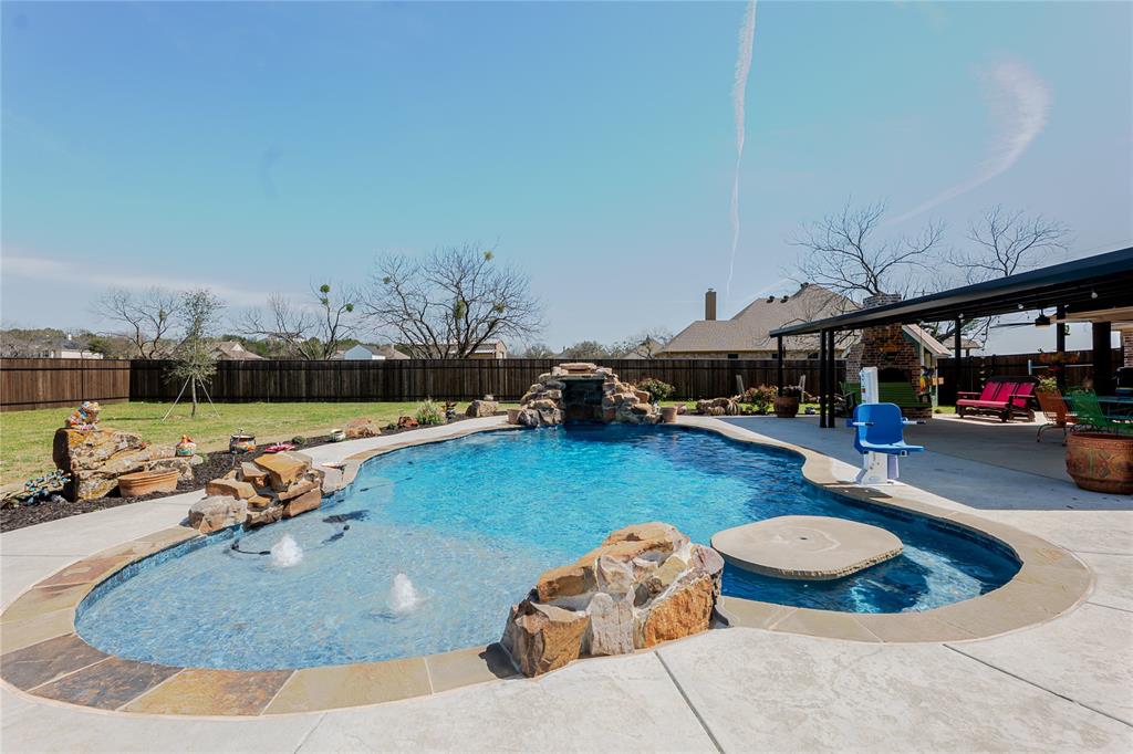Welcome to 470 Wilson Bend Rd. in Millsap, Texas. Where character, craftsmanship, and outdoor living come together.
This beautifully maintained 4-bedroom, 2-bath home offers a functional layout designed for both everyday living and entertaining. Inside, you’ll immediately notice the home’s unique charm, featuring custom hand-troweled plaster walls with rich turquoise and copper patina tones, giving the home a distinctive old-world, artisan feel you rarely see.
The spacious kitchen offers ample cabinetry, a large island, and opens seamlessly to the main living and dining areas, creating a warm and inviting space for gatherings. Rustic details, beautiful wood beams, and thoughtful finishes throughout add to the home’s character.
The primary suite is designed with convenience in mind, featuring a laundry room that connects directly to the primary closet and bathroom, making daily routines effortless.
Step outside and discover an incredible backyard retreat. The extended covered patio overlooks the sparkling swimming pool, creating the perfect setting for relaxing evenings, entertaining guests, or enjoying warm Texas summers.
Additional features include a two-car garage, spacious secondary bedrooms, and a layout that balances comfort, style, and functionality.
Located in Millsap ISD with easy access to Weatherford, this home offers the perfect blend of small-town living and unique character.
If you’re looking for a home with personality, craftsmanship, and a backyard made for entertaining, this one is a must-see.