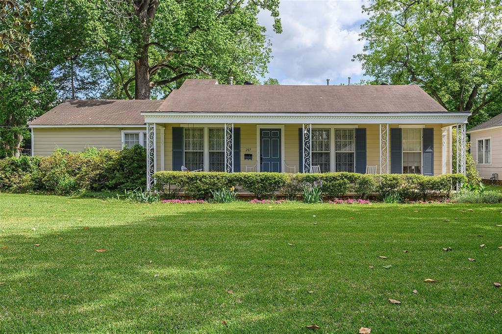 Charming Broadmoor home with a lot to offer! This home features a wide front porch with columns and floor to ceiling windows. Formal living and dining rooms. Eat-in kitchen. Split plan with two bedrooms on one side and two bedrooms on the other. Master bathroom has been remodeled. Three hall closets for storage. Mostly hardwood floors throughout. Exterior painted in 2025. Kitchen with butcher block counters, built-in dishwasher, double sink.