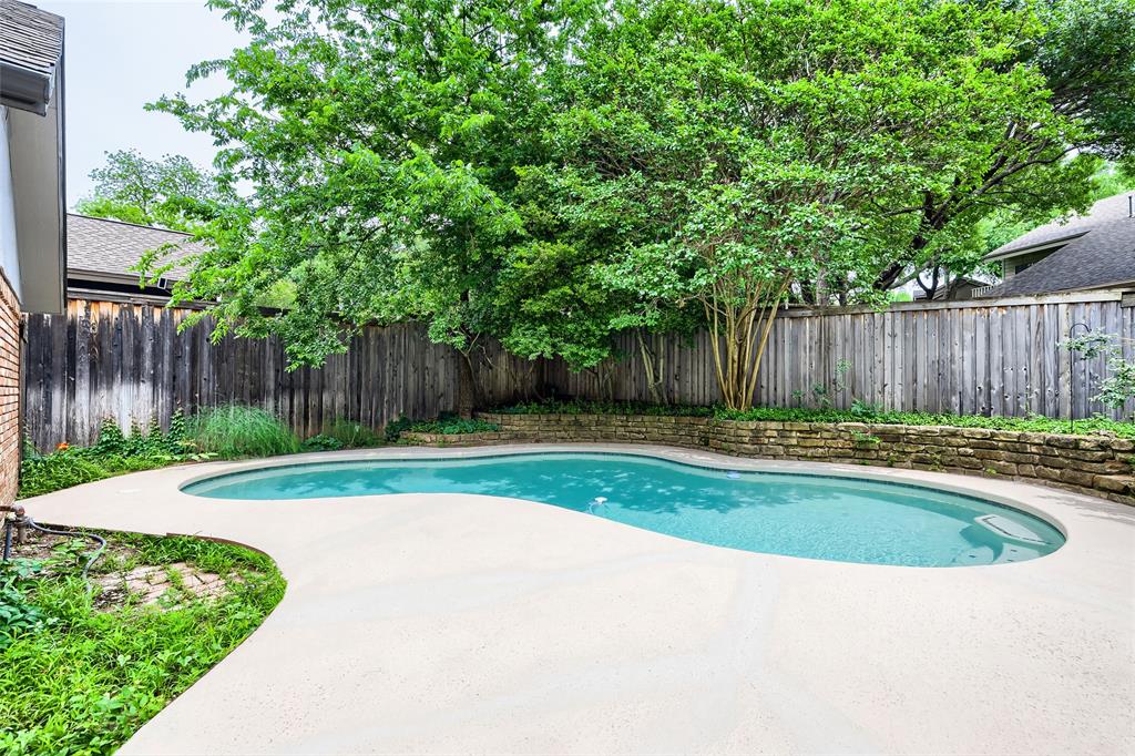 Seller offering up to 2.5% in seller credits to use towards rate buy down or closing costs with preferred lender. In the heart of Dallas, this 4-bedroom, 2-bath home offers great potential along with a private backyard pool. Step inside to a spacious, open floor plan highlighted by a cozy fireplace and original stone accents that flow into the kitchen, adding warmth and character throughout. The kitchen features beautiful stone countertops that complement the home’s natural charm. The bedrooms are generously sized with ample closet space, providing comfort and functionality for everyday living. Outside, the backyard is ready to be transformed into your own oasis—complete with a large pool and plenty of room for entertaining, relaxing, or creating the outdoor retreat you’ve been envisioning. A fantastic opportunity in a prime Dallas location
