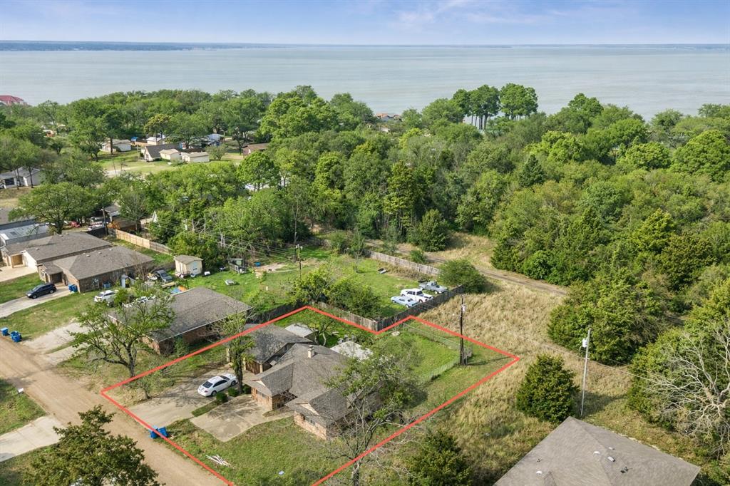 **Seller is offering a $5K credit for buyer to finish out the floors**. Investment opportunity or .48AC lot sale, just steps from the water in Loon Bay. Seller has thoughtfully remodeled both the kitchen and living room with vaulted ceilings and low maintenance finishes. Make this home your own with plenty of opportunity to put finishing touches on the bedrooms and bathrooms. Close to POA boat launch within the subdivision as well as shopping, groceries, dining and more. This is an As Is Sale - seller will make no repairs.