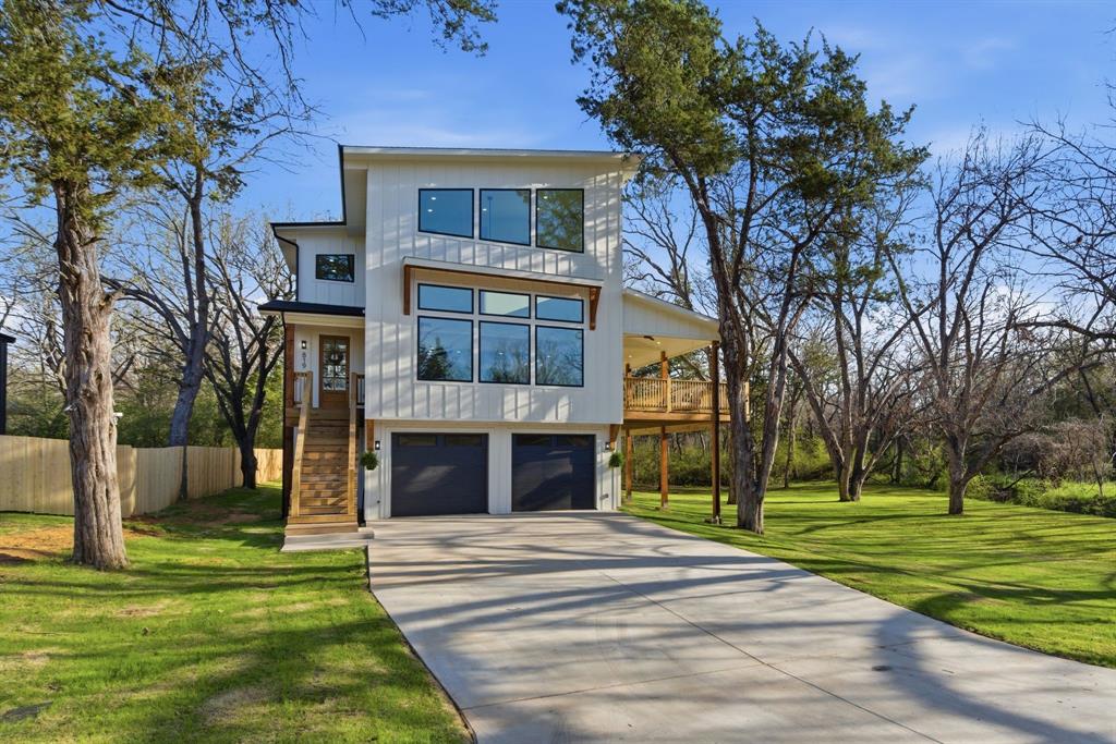 Enjoy modern family living in this contemporary home featuring 3 bedrooms, 3 bathrooms, Designed for both comfort and flexibility, this home offers an open-concept layout your family and guests will love.
The heart of the home includes a spacious great room with fireplace, an island kitchen with walk-in pantry, and a versatile dining area that flows beautifully for everyday living and entertaining. Step outside and enjoy the large porch overlooking a creek and park-like setting, along with deck and patio areas perfect for outdoor gatherings.
Upstairs, the primary suite serves as a peaceful retreat with a walk-in closet, freestanding tub, large shower, double sinks, and a private water closet. An additional upstairs bedroom would make a beautiful nursery or kids’ room. On the main floor, a separate bedroom provides a comfortable space for guests or in-laws.
The ground level offers exceptional versatility with a large oversized garage, three storage rooms, wash station, and mudroom. This area is spacious enough to support a small home-based business, such as a dog washing station, podcast studio, or office. 
With no HOA, you’ll have the freedom to create the lifestyle you want, whether that means starting a small farm, planting a garden, or running a home-based business without added restrictions. Features & Details
 3 Bedrooms
 3 Bathrooms
 Kitchen Island
 Walk-in Pantry
 Primary Bedroom Upstairs
 Walk-in Closet
 Great Room with Fireplace
 Main-Level Laundry
 Loft, Balcony
 Large Mud Room
 Open Floor Plan
 Lots of Storage Space
 Vaulted Ceilings
 Large Porch with Creek and Park-Like Views