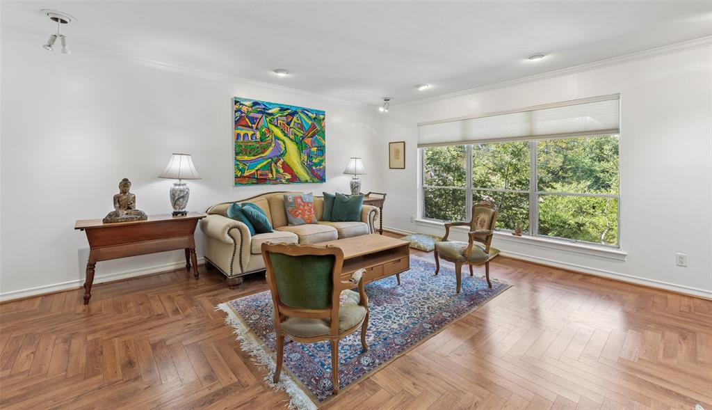 This mid-century modern Park Carillon condo provides a quiet and serene escape from the hustle and bustle of in-town Dallas.  Located on the second-floor rear of a beautifully maintained two story mid-century building, it’s so still and serene you can hear a pin drop. HOA fee includes all utilities plus internet.  Both living room and den have large windows with treetop views. A spacious balcony off the den overlooks a sparkling, newly renovated pool. The perfect place to sit and watch the clouds roll by. Built in bookcases and cabinets in the den with a raised ceiling, as well as built in storage cabinet and bar area with new granite.   A spacious layout of light filled rooms have been recently painted throughout. New kitchen appliances and countertops, new fans in eat-in kitchen and in dining area, new carpet in both bedrooms and closets. Two newly renovated bathrooms with new sinks and granite countertops.  Just minutes away from both Central Expressway and the Dallas North Tollway, the area around Preston Rd. and Northwest Highway offers excellent restaurants and shopping. Central Market grocery shopping is five minutes away. As is access to shopping at NorthPark Mall.
Easy access to downtown Dallas for work and culture.  Owners will consider a loan buy down to assist buyers.