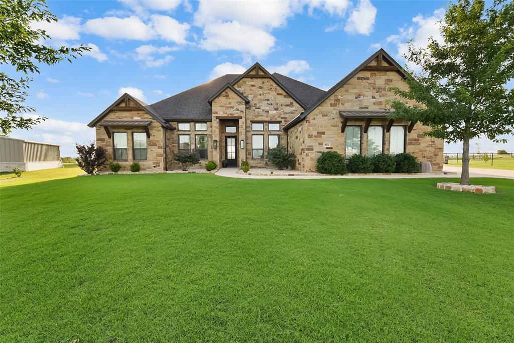 Tucked inside an exclusive gated community in Godley, Texas, this luxury estate captures the best of North Texas living with privacy, resort-style amenities and sunset views. With over an acre at the end of a quiet cul-de-sac, this property offers refined comfort, outdoor living and peaceful country atmosphere-close to Fort Worth, Cleburne, Granbury and Chisholm Trail Pkwy. From the moment you arrive, the setting feels special. With no neighbor behind, the backyard opens to wide Texas skies, green space and calm. Evenings are made for golden-hour gatherings, dinner on the patio, outdoor play and sunsets that turn the property into a picture-perfect retreat. The outdoor living experience is exceptional, with an oversized pool designed to accommodate large gatherings without feeling crowded. Its scale allows multiple activities at once, enhancing the resort-like atmosphere for entertaining and relaxation. A spa, fire pit, outdoor kitchen and patio space complete the setting for cookouts, game-day watch parties or evenings under the stars. Inside, spacious living areas, thoughtful design and beautiful finishes create a warm yet sophisticated setting for everyday living and entertaining. The open-concept layout connects the kitchen, dining and living spaces, while large windows invite natural light and frame views of the pool, backyard and open space. A dedicated office and flexible bonus room—currently a game room with potential as a fifth bedroom, media room, playroom or exercise space—add versatility. The private acreage provides room to breathe, gather and enjoy the outdoors without sacrificing the security and polish of a gated neighborhood. With space for pets, play, gardening and entertaining, it offers the relaxed Texas lifestyle buyers dream about. More than a home with a pool on acreage, it is a place to gather, unwind and make memories. A place where mornings feel peaceful, weekends feel like a getaway, and every evening ends with a sunset worth stopping for.