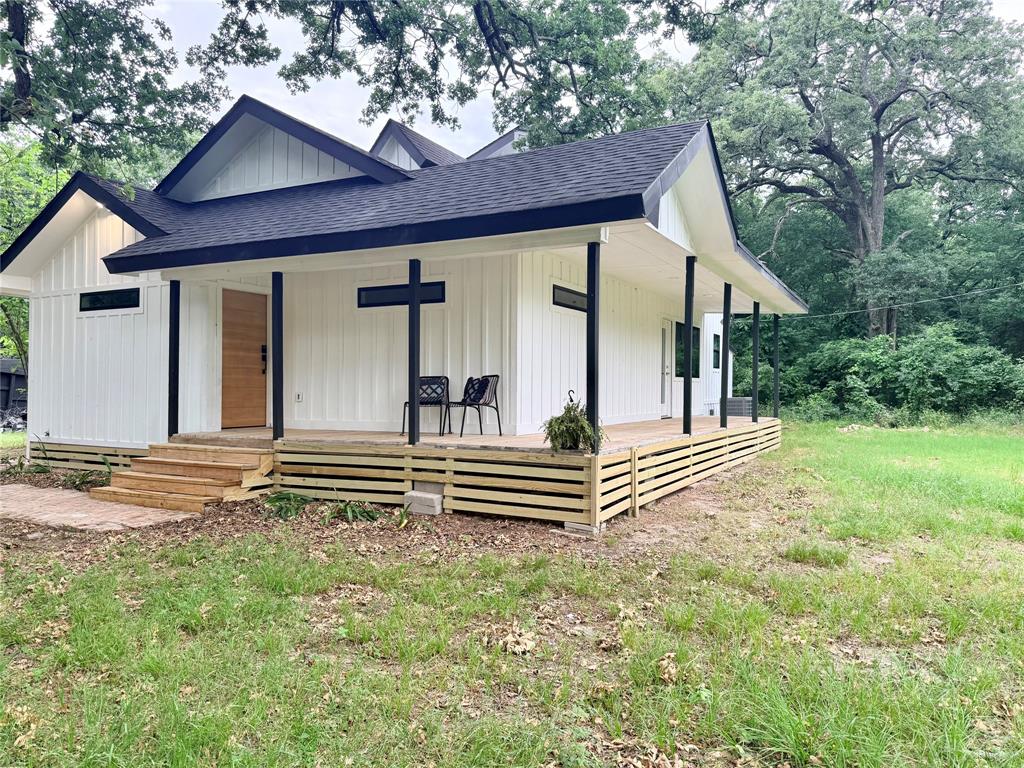 1.3 acre lake retreat just steps from Lake Tawakoni, fully renovated with new roof, HVAC, windows, plumbing, electrical and more. This open concept home features vaulted ceilings, a spacious kitchen with island, and large picture windows overlooking huge oak trees, wooded acreage, and wildlife. Enjoy huge decks perfect for relaxing and entertaining. Flexible layout with 4 full bedrooms, office space and a spa like primary suite. Ideal for a vacation rental, primary home, or investment. No zoning restrictions offer endless potential for future tiny homes or adding one or two more homes for income opportunities. This beautiful property is located in excellent Rains ISD and is a must see.