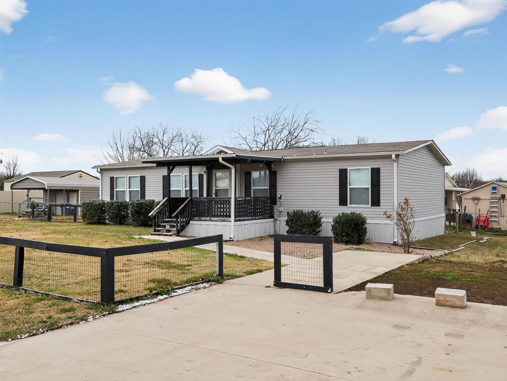This well-maintained, move-in-ready home offers generous living space and a comfortable, functional layout within the gatedHoliday Village community on Lake Fork in Quitman. Designed for easy living, the home features open, flexible living areasand a spacious primary suite with a large ensuite bath, complete with a relaxing garden tub. Clean finishes and updatedflooring in main living areas create a bright, inviting interior that’s easy to maintain and ready to enjoy. The layout worksequally well for full-time living, weekend use, or lock-and-leave convenience, making it a great fit for retirees, families, orfishermen seeking space without excess upkeep. Residents of this gated community enjoy access to amenities including acommunity center, pool, boat docks, and playgrounds—enhancing everyday living while offering options for both relaxationand family-friendly activities. Located minutes from world-famous Lake Fork, renowned for trophy bass fishing, this home isan excellent option for anglers and outdoor enthusiasts, as well as DFW-area buyers seeking a peaceful lake-area retreatwhile remaining close to local services and conveniences. Whether you’re a dedicated fisherman, looking for a comfortableprimary residence, or seeking a weekend getaway near one of East Texas’s most iconic lakes, this property delivers space,livability, and the added benefits of gated community living.