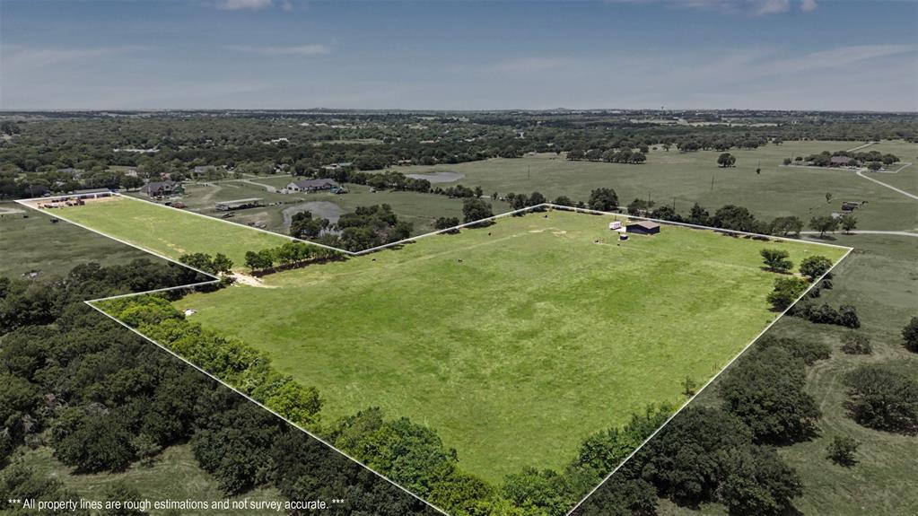 RARE opportunity to own 12 fully fenced acres in the highly sought-after Joshua ISD! Located just outside city limits with an Ag Exemption so LOW Taxes! This property offers endless possibilities with NO known restrictions. Within the last year a 30’ x 60’ insulated shop with Electric & Water was installed. Perfect for any Business, Workshop, Storage or Recreational use. At the back of the property you will find a 37’ x 37’ barn with 4 Stalls, Wash area and more with an additional 30’ x 37’ concrete slab, with electricity and water run to the center of the property for added convenience. 

The entire 12-acre property is clean, well-maintained, and fully fenced. A pipe fence with no-climb wire creates an attractive and secure frontage, while the rear perimeter is enclosed with 5-strand barbed wire fencing. Water and electricity are available on both tracts, providing flexibility for future homesites, livestock, agricultural use, or expansion.

Whether you’re looking for a place to build your dream home, family compound, operate a business, keep horses or livestock, or simply enjoy wide-open Texas space, this property offers the infrastructure and freedom to make it your own.