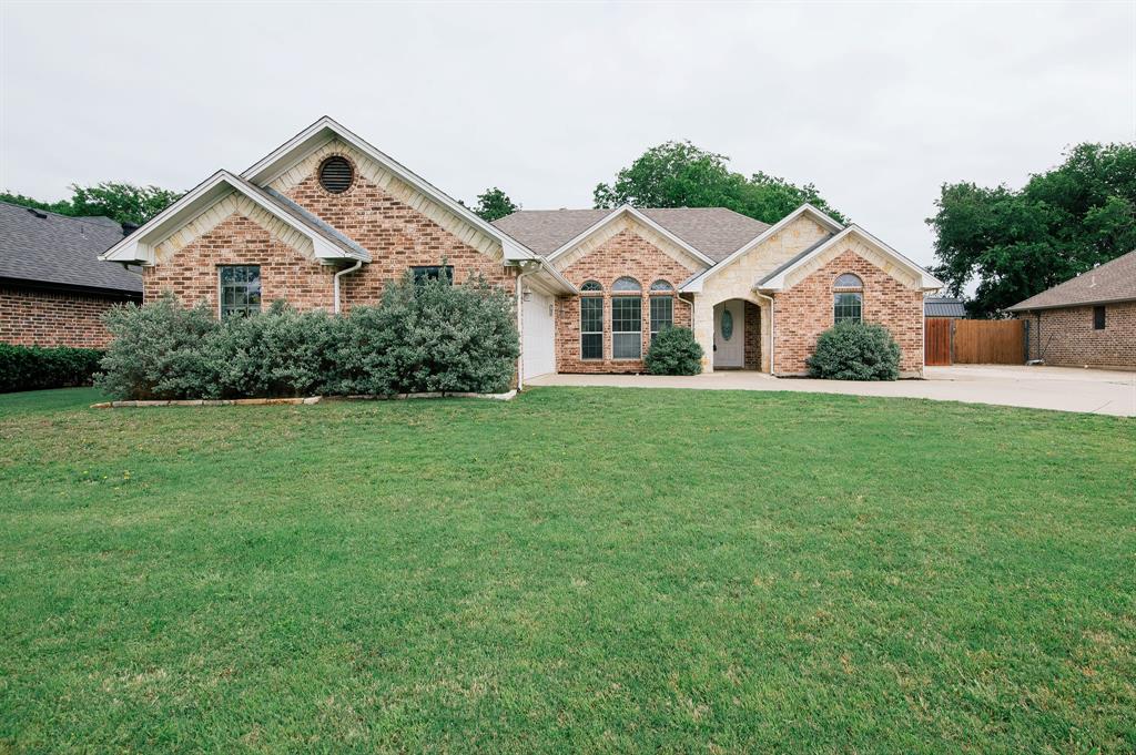 Welcome home to this charming single-story brick home on nearly a third of an acre in the heart of Aubrey! 3 bedrooms, 2 baths with a split floor plan. The kitchen features granite counters, built-in cabinets, and stainless steel appliances. Step outside to your spacious backyard with a beautiful shade tree and an extended patio perfect for family, friends and entertaining. The fully fenced yard gives kids or pets plenty of room to play. Zoned for sought-after Brockett Elementary and steps from McNab Middle School. Take evening strolls through the quiet neighborhood behind the house or walk to downtown Aubrey and the newly renovated Matthews Park. The location could not be better just minutes from Lake Ray Roberts, the Greenbelt Trail, and convenient to Denton, Frisco, and the new Costco in Windsong. Recent upgrades include new flooring, a brand new AC unit (2025), and updated fixtures. No HOA. This is the home you have been looking for!