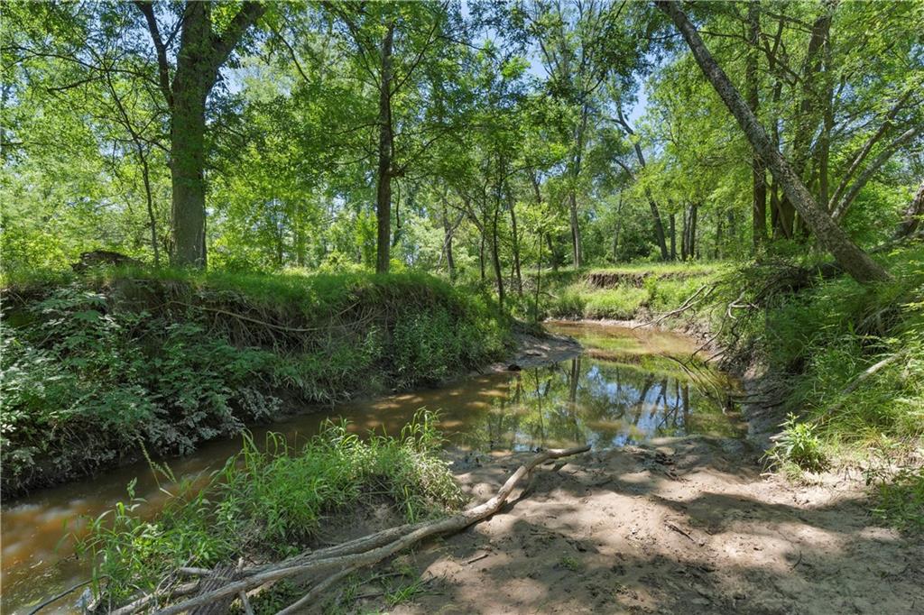 Beautiful property! 245+/- acres in Robertson County! Located less than 1 mile from HWY-6 and downtown Calvert! Lots of wildlife! Deer,
ducks, bobcats, hogs and other critters. 2 big stocked ponds! There is an even mix of open pasture and woods. The property is fully
fenced and crossed fenced! There is a new construction barndominium shell ready to be finished out the way you want it! An open layout of 1,600 sqft of living space plus the 200 sqft porch! There is also a 2,400 sqft shop with concrete floors that could be converted into a 2nd home! Great grazing pastures! Tidwell creek also runs through a portion of this property! Plenty of water to irrigate the pastures! Even better, there are no pipelines, towers, easements or leases! One of the neighboring properties is the Calvert Country Club! City utilities available! Schedule a showing today!