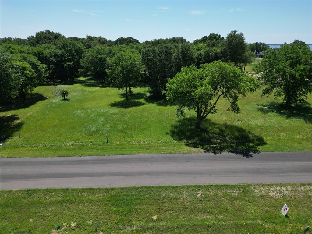 Build your dream home in gated community within city district of Kemp. Owners enjoy city-maintained paved roads, city water and sewer, and fiber-optic internet. Store your boat or jet skis in the community’s locked, fenced storage area and launch from the neighborhood ramp with day-use slips. Several new million-dollar waterfront homes are nearby, contributing to strong long-term value.  Golf membership available, enjoy stock ponds and no HOA. Conveniently located just off Hwy 175, offering an easy commute of under an hour to downtown Dallas.  Minimum 1,800sq ft of HVAC living space required.  Boathouse can be built with TRWD permit.