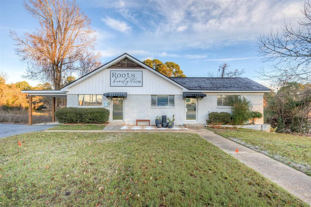 Commercial property located at 601 Homer Rd, Minden, LA 71055. This 1,715 sq ft space is currently operating as a hair salon and offers flexibility for a variety of potential uses. The interior includes a main open area, multiple separate rooms suitable for offices, treatment rooms, or workspaces, and a small kitchen area with sink. Situated in a convenient, high-traffic location with good visibility, the property offers on-site parking including a single covered carport space. The layout allows for easy reconfiguration to meet the needs of a new owner or business. Ideal for service-based businesses, professional offices, or boutique retail, subject to zoning and buyer’s intended use. Excellent opportunity to own commercial space in a desirable Minden location.