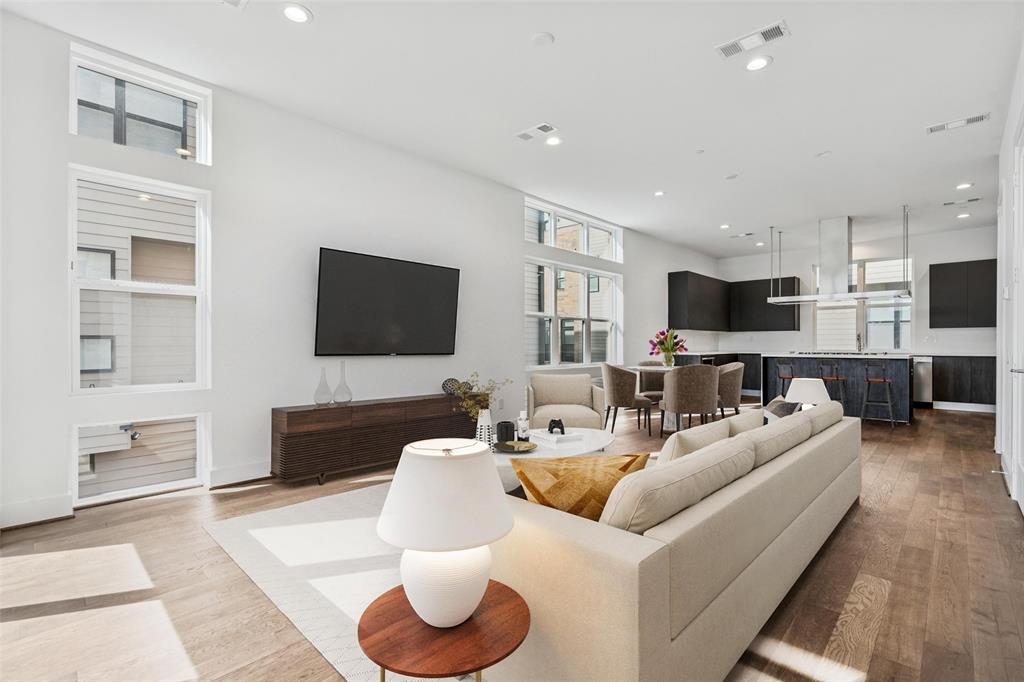 Built by Urban Lofts Townhomes, this modern corner unit at 3032 Chimes Street offers 2,871 square feet of thoughtfully designed living with 4 bedrooms, 4.5 bathrooms, a private 2 car garage, and a fenced front yard in one of Dallas’s most ideal locations. As a coveted corner unit, the home features additional windows throughout, enhancing natural light and creating a bright open feel across all levels. Hardwood floors complement a very open floor plan that flows seamlessly across multiple levels, ideal for entertaining and everyday living. The layout includes two spacious living areas and is pre designed to accommodate a future elevator if desired, offering long term flexibility. The kitchen anchors the main living level with stainless steel appliances, a gas cooktop island, built in wine refrigerator, and custom cabinetry. Bedrooms are generously sized with abundant walk in closet space throughout. Outdoor living is highlighted by a second floor covered patio and a fourth floor rooftop terrace with expansive views of the downtown skyline, providing an exceptional setting for both relaxing and entertaining. This townhome offers exceptional space, flexibility, natural
light, and downtown views in one of Dallas’s most desirable locations.