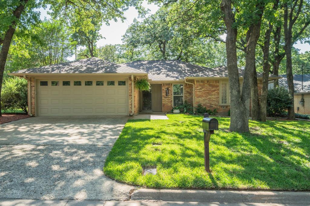 Welcome to this beautiful corner lot home located on a well established wooded street in Martin HS district. This home has been meticulously cared for and updated with a modern farmhouse feel. The entire home has been professionally painted inside and out! The living area has high vaulted ceilings, wood beam, new ceiling fan, wood burning fireplace and lot's of natural light. The kitchen features a brand new double oven and matching built in microwave, recessed LED lighting, professionally painted cabinets inside and out with slow close hinges on cabinet doors. It also has under the cabinet lighting and brand new Italian Botticino marble tile backsplash. The dining area is complemented with a wall of windows, new light, gorgeous built in hutch, and a 5 window barn door. The generous size master bedroom has a separate large seating area that would be perfect for reading, home office or multiple uses. A wooden barn door will lead you to the primary bathroom. Master bath has a large walk in shower with bench seat and dual walk in closets. The backyard has a covered patio and an oversized stained concrete area for grilling and entertaining. All this and a brand new roof. Brand new windows. New AC installed in 2024. Full size utility room with deep floating shelves. Both secondary bedrooms have walk in closets.