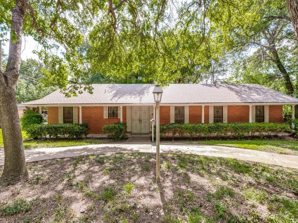 A move-in ready find, surrounded by beautiful, mature trees, nestled within a well-established neighborhood; this unique property offers comfort, character, and thoughtful updates. The home features 2-bedrooms and 2 beautifully updated bathrooms an updated kitchen that showcases elegant marble flooring, natural stone countertops, and accented cabinetry that adds warmth and style. The open-concept living and dining areas provide an inviting space for gathering and entertaining, complete with a cozy fireplace and built-in shelving and cabinetry that offer both functional storage and attractive display space. Natural light fills the home's main living areas and extends into the enclosed patio, creating a bright, welcoming space to relax and enjoy year-round.