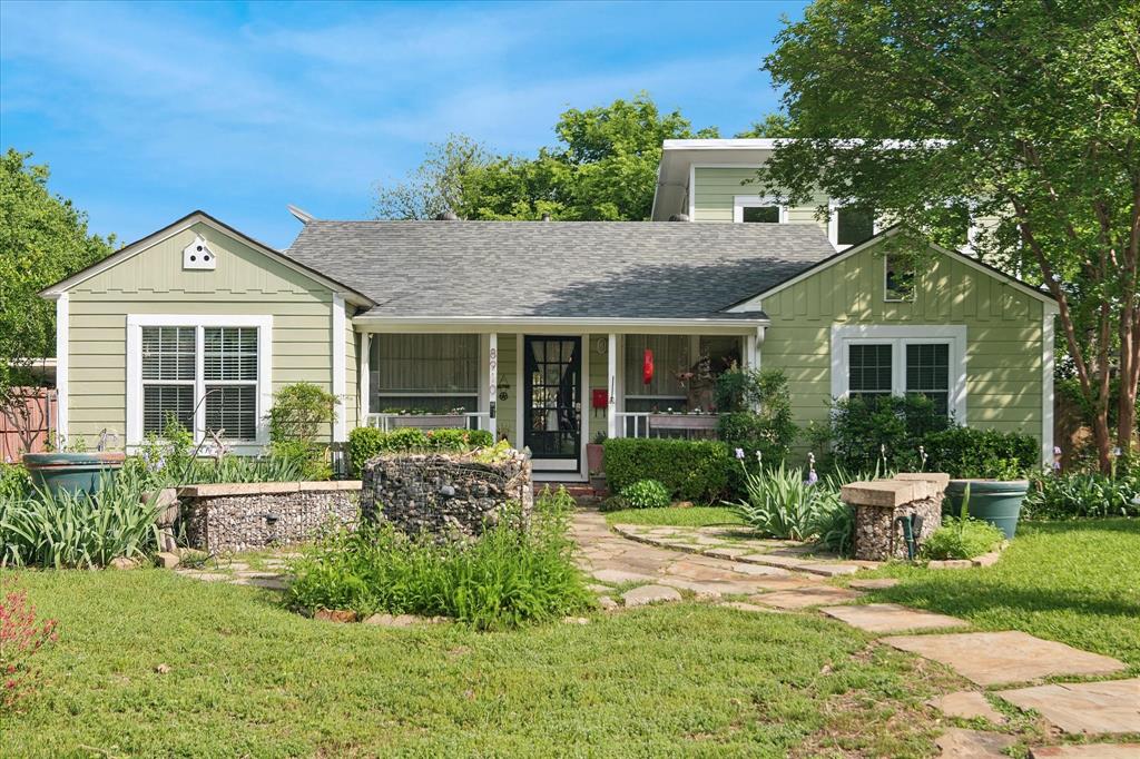 Located in the fun and eclectic Little Forest Hills neighborhood, this warm and inviting home captures the character and charm the area is known for. Step inside to a welcoming living space with an open layout and views through the home to the backyard. The kitchen opens to the living area, creating an easy flow for everyday living and entertaining, while a separate dining room offers a dedicated space for gatherings. Wood floors run throughout, adding warmth and continuity. The primary suite features a large walk-in closet and a nicely updated bath, while two additional bedrooms provide flexibility for guests or a home office. Outside, the spacious, tree-filled yard is a true highlight with a deck, patio areas and plenty of room to relax or entertain. A detached two-car garage includes a bonus space above—perfect for a studio, office or additional living area. Situated just minutes from White Rock Lake, with easy access to local dining, shopping and downtown Dallas, endless possibilities await you in this charming home.