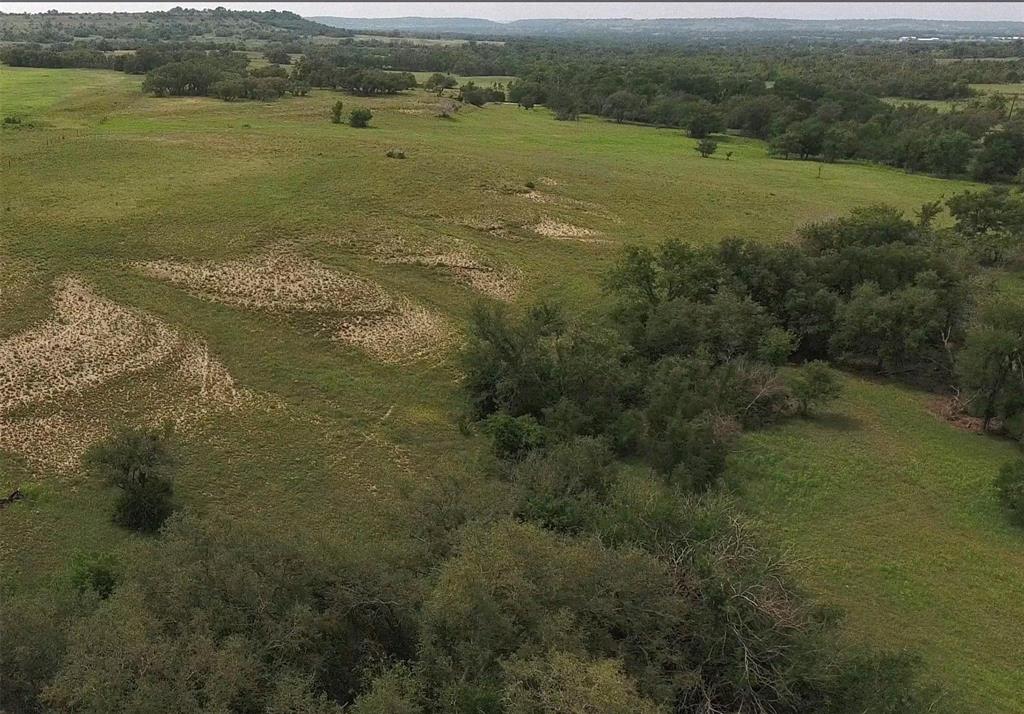 This beautiful  tract has it all-Rolling terrain, stunning views, spring-fed creek, and great hardwoods consisting primarily of oak and elm trees.  The creek meandering through the property surrounded by mature trees provides great cover for wildlife. The rolling terrain offers several potential homesites with endless views.  The hunting blind and portable building will convey with the sale. This property is located north of Star, Texas on County Road 512, less than a mile off of paved FM 1047. The property has good fencing on all four sides. Electricity is available. Buyer will need to drill a well. All owned minerals will convey with the sell, and the property is currently ag exempt with NO RESTRICTIONS. Whether it is recreation, hunting, or a future homesite you are looking for, don't let this one pass you by! This property is conveniently located to Austin, San Antonio, Waco, and the Metroplex.
