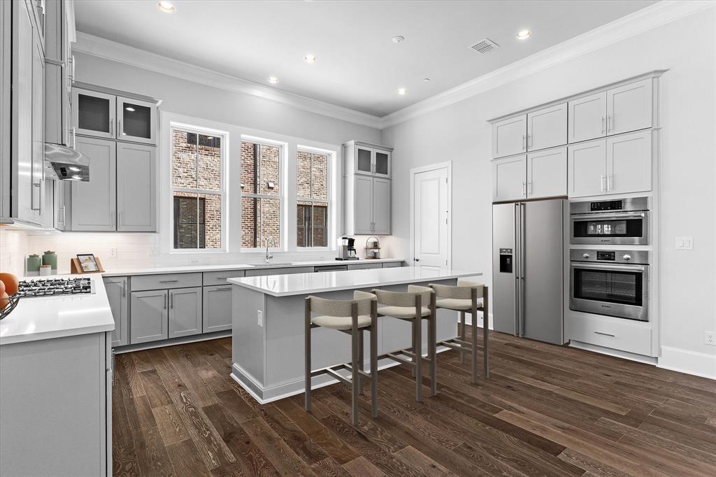 NEW- MODERN -3-Story w basement Townhome in Addison. AUGUST 2026 COMPLETION. This stunning 2647 SF, 3 bed, 3.5 bath ,2 car garage home blends modern luxury with architectural distinction, showcasing a timeless brick exterior and unique design you won’t find anywhere else. Located on a premium GREENSPACE lot. Step inside and be greeted by a large open foyer filled with lots of natural light and 1st floor study and guest bedroom.  Soaring 12-ft ceilings, tall 8-ft doors, and expansive ANDERSON windows that frame beautiful views. Every detail is elevated with all-wood flooring, 6-inch baseboards, and luxury craftsmanship throughout. The gourmet kitchen is a chef’s dream with quartz countertops, premium Bosch appliances, and furniture-grade double-stacked soft-close cabinetry. A spacious dining and living room with gorgeous fireplace and large 10 ft. sliding  glass  doors open to a spacious balcony over looking a lush landscaped setting—Perfect for entertaining or relaxing under the Texas sky. 3rd level is a spacious master retreat with  large WIC with laundry accessible from master closet. Abundant storage in spacious basement off of the 2-car garage with electric car plug, abundant storage, and a low HOA of just $145 a month. Located in the vibrant town of Addison, this home offers a walkable lifestyle near top restaurants, shops, parks, ADDISON ATHLETIC CLUB and trails, with Dallas’ finest attractions only minutes away including DFW and Love airports. This residence is not just a home—it’s a lifestyle of elegance, convenience, and architectural distinction.