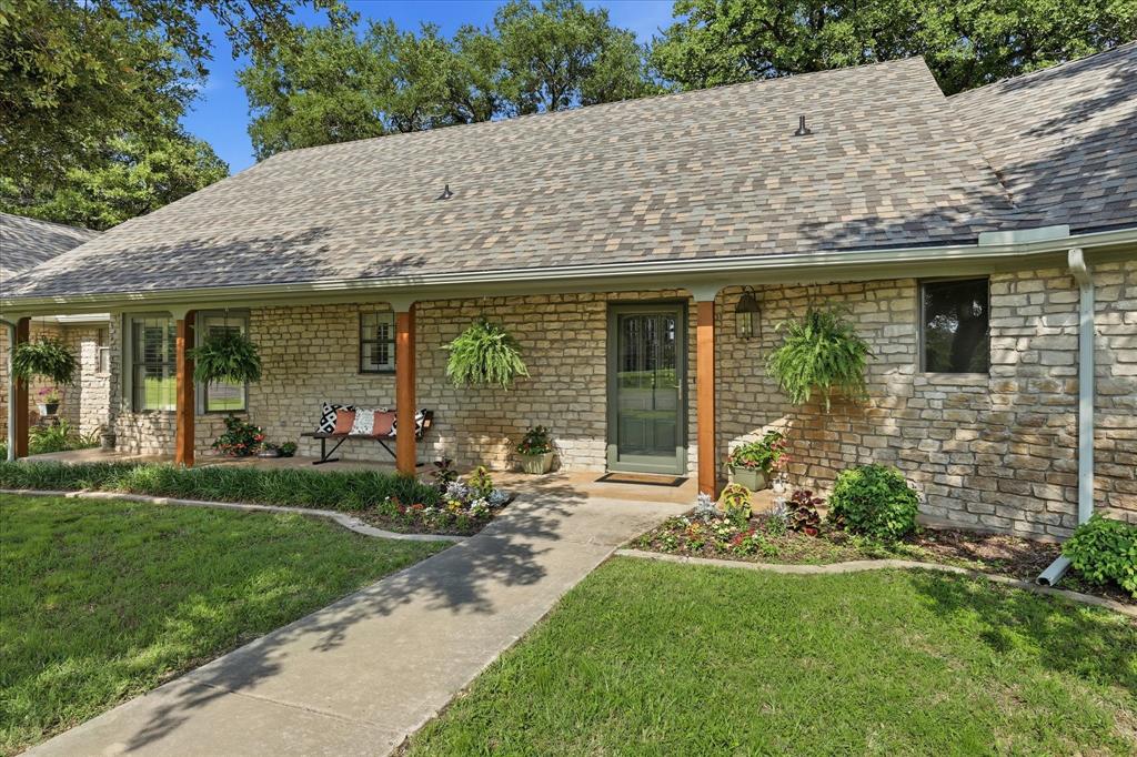Come SEE this Enchanting NEWLY Renovated Home on Cul-de-sac in coveted neighborhood. NEW roof, NEW gutters, NEW HVAC systems, NEW hot water heater. This 2+acres is nestled in a Natural Environment of serenity. The Industrial Farmhouse design is an entertainer's dream with the open concept living areas, wood burning fireplace and wet bar. Gorgeous Granite in gourmet kitchen. Great floorplan with split bedrooms. Luxurious primary bedroom, NEW carpet, sitting area, spacious closets, spa-like bathroom featuring dual vanity, Granite Countertops and walk-in shower with a variety of heads including rain shower. Sizeable laundry room with countertop. A cedar closet and Tons More closet space and storage throughout the home. Huge NEW deck adds 400 sf of outdoor living. Relax as you look out over your Backyard Oasis of breathtaking trees and greenery. Sloping terrain provides backyard access to a Walkout Basement-a great multipurpose space. A Second Driveway to garage has extra parking for your boat, RV, etc... Property backs up to an amazing scenic creek. So come out to see this Beautifully Landscaped home with Expansive Lawns and enjoy the Small Town Charm of Bridgeport where you'll find a great variety of restaurants, Quaint Downtown, family friendly atmosphere and recreation activities at nearby Lake Bridgeport.  Easy access to 380 and 114. Buyer and Buyer's Agent to verify all information.
