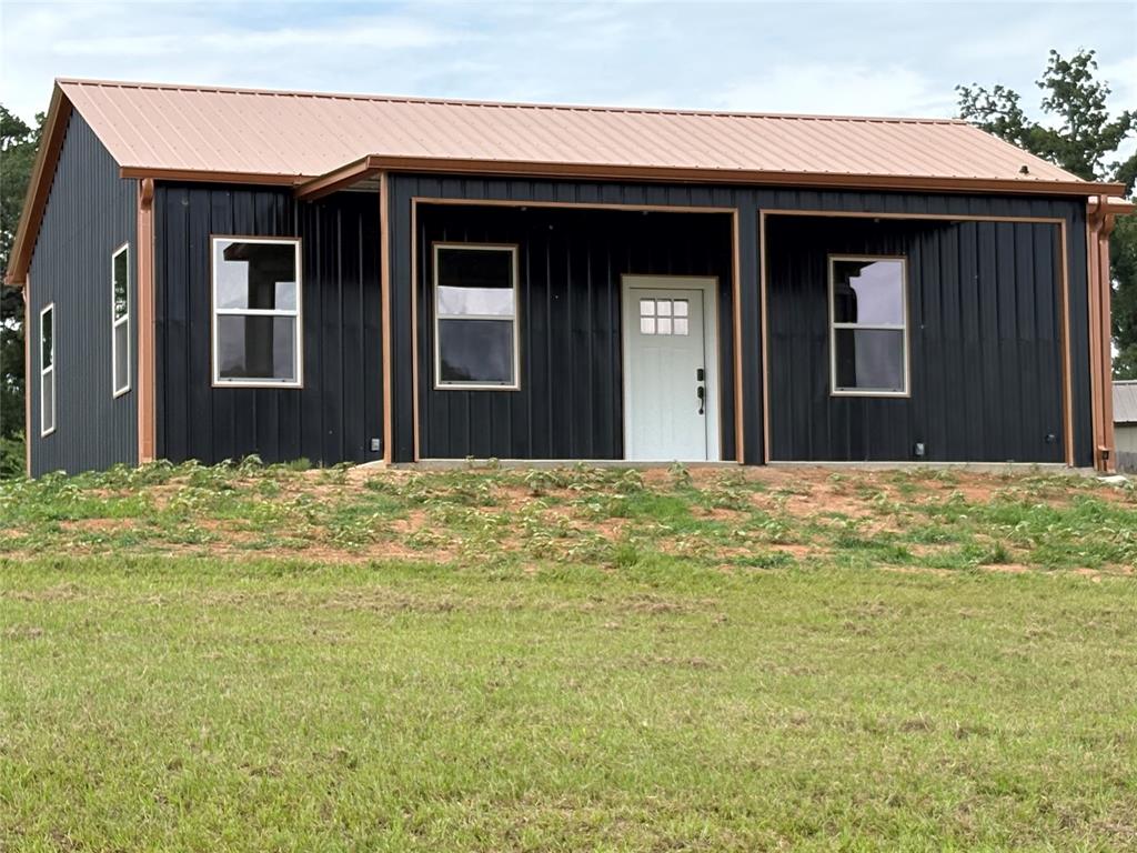 New construction barndominium located in Holiday Village of Lake Fork! This beautiful 2 bedroom, 1 bathroom home sits on approximately .7315 of an acre and offers a peaceful view from the spacious 10x25 front porch — the perfect place to enjoy your morning coffee or unwind in the evenings. The home also features an 8x10 back porch for additional outdoor space.

Inside, you’ll find an open layout with lots of windows providing great natural light, custom cabinets, granite countertops, and a stunning tile shower with a beautiful glass door. Conveniently located close to the boat ramp on Lake Fork, this property would make a great full-time home, weekend getaway, or investment property.

Residents of Holiday Village of Lake Fork enjoy access to great community amenities including a clubhouse, swimming pool, playgrounds, basketball court, fishing ponds, fishing pier, and multiple boat ramps into Lake Fork.

Home is nearing completion with more pictures coming soon!