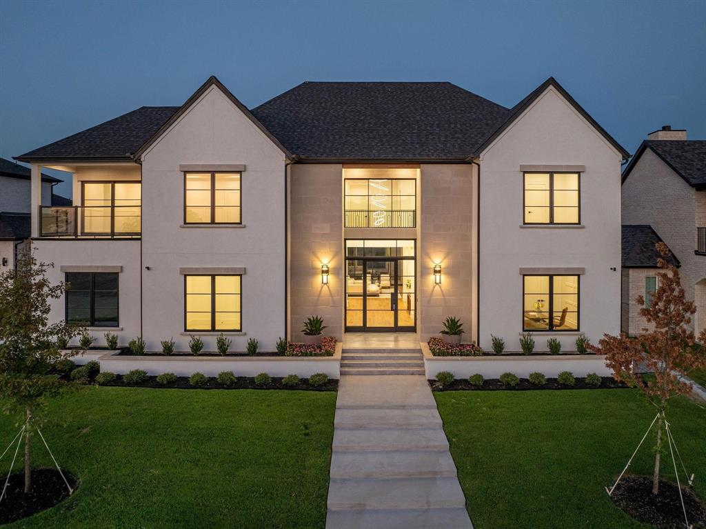 Experience luxury lake living in this stunning Fields Custom  estate, featuring panoramic views and an open-concept design.  The chef's kitchen boasts commercial-grade appliances, a waterfall quartz island, and a wine room.  The inviting living room, with a soapstone fireplace and custom built-ins, opens to a spacious patio with a wood-planked ceiling and outdoor fireplace.  The primary suite offers a spa-like bath with an oversized shower, freestanding tub, and a dream closet with direct laundry access.  The main floor includes a study and guest suite, while the upper level features a game room with lake views, a wet bar, three ensuite bedrooms, a second laundry room, and flexible space.  Enjoy the amenities of the Heath Golf & Yacht Club, including dining, a gym, tennis, boating, and pickleball, all within this sophisticated estate that epitomizes lakeside living.