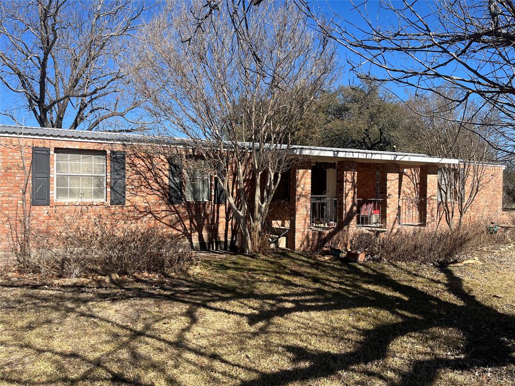 Here is 66 acres of beautful Texas countryside, this property offers the perfect mix of comfort, character, and wide-open space. The land features sandy soil, coastal and lots of beautiful post oaks, creating a picturesque setting ideal for livestock, excellent hunting or simply enjoying nature and privacy.
The home is mobile home that is totally bricked exterior with 3 bedrooms 2 baths with every bedroom having a nice walk in closet providing great storage. The exterior includes a covered carport, a brand new fence along side and back for goats. The back of the house has a large back deck perfect for morning coffee, evening sunsets, or entertaining guests while taking in the peaceful views. With plenty of room to roam, this property is ideal for those seeking rural living with modern comforts. Whether you are looking for a hobby farm, a family retreat, or your owns slice of Texas paradise, this 66 acre property is ready to make your vision reality