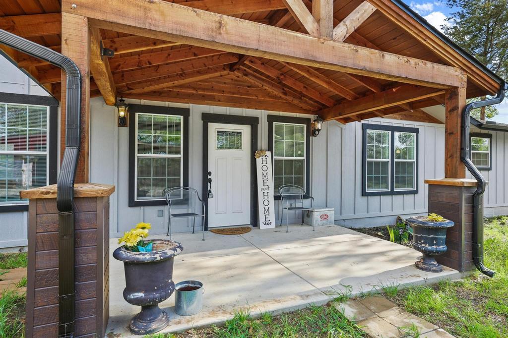 Modern farmhouse offering 4 bedrooms and 2.5 baths, thoughtfully designed with a blend of upscale finishes and rustic wood accents. The interior features abundant natural light, quality craftsmanship, and premium building materials throughout, creating a refined yet comfortable living environment. Open living areas provide functional flow for everyday living and entertaining. Covered porches offer additional outdoor living space. The property includes a detached shop with dirt floor and lean-to for covered parking. Situated in a private setting while maintaining convenient proximity to shopping, dining, and local amenities. Buyer to verify all information.