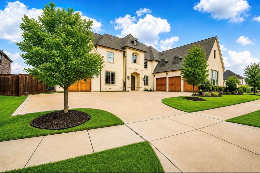 Nestled within the prestigious Park Place Estates community, this property is a rare expression of French-inspired luxury where timeless architecture, exceptional craftsmanship, & modern sophistication converge.
Constructed by Shaddock Homes & situated on a coveted corner homesite, this extraordinary residence offers an unparalleled lifestyle defined by privacy, elegance, & resort-style living. Behind its stately façade, distinguished by cast stone accents, arched dormers, cedar corbels, copper gas lanterns, & artisan masonry, lies a home thoughtfully designed for those who appreciate beauty in every detail.
The private backyard serves as a personal retreat, anchored by a heated saltwater pool & spa crafted by Foley Custom Pools. Water features, lush landscaping, & expansive outdoor living spaces create an atmosphere reminiscent of a boutique luxury resort.
Inside, soaring ceilings, extensive millwork, solid knotty alder doors, & exquisite architectural detailing establish a sense of grandeur rarely found in today’s market. Every space has been curated to balance formal elegance with everyday comfort, creating an environment equally suited for intimate family gatherings & sophisticated entertaining.
Located within the award-winning Frisco ISD, serving Vaughn Elementary, Pioneer Heritage Middle School, & Wakeland High School, the property combines exceptional educational opportunities with one of Frisco’s most desirable addresses.
For automobile enthusiasts, the residence offers an extraordinary garage configuration including a 42-foot tandem garage designed to accommodate vehicle lifts, a separate 3-car garage with electric vehicle charging capability, & ample storage for prized collections.
Throughout the home, luxurious amenities such as whole-home surround sound, central vacuum, monitored security, indoor fire suppression systems, and custom architectural finishes reflect a commitment to uncompromising quality & enduring value.