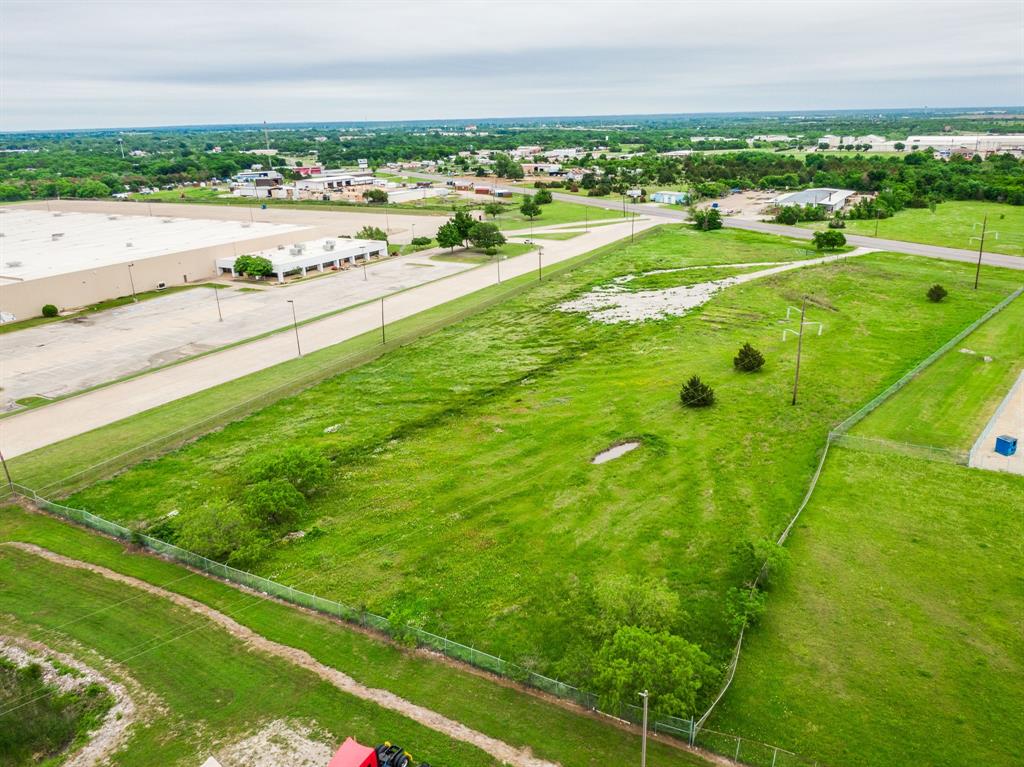 Fenced all the way around with a gate. Zoned light industrial commercial. MUST SEE!