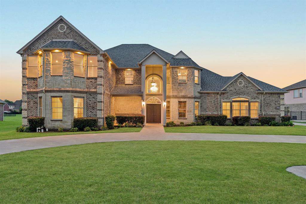 Welcome to a rare blend of luxury, space, and flexibility in the highly sought-after Lake Ridge community! This stunning custom-built 2016 home sits on over an acre in acclaimed Midlothian ISD, offering the perfect balance of elegance and everyday comfort.
From the moment you enter, you’re greeted by impressive ceiling heights, a striking entryway, rich marble floors, and detailed custom craftsmanship that elevate the entire space. The home lives large, with expansive rooms and a seamless flow that feels both open and inviting. The main level offers a highly functional layout with 2 bedrooms, 2.5 baths, and a private study, perfectly suited for multi-generational living or hosting guests in comfort.
Upstairs is designed for both relaxation and versatility, featuring 3 additional bedrooms, an oversized gameroom, dedicated media room, and two flexible bonus spaces ideal for a home gym, creative studio, or additional office setups.
The chef’s kitchen is a true centerpiece, complete with a 6-burner Thermador gas range, pot filler, double ovens, oversized island, and an expansive walk-in pantry, designed for both entertaining and everyday living.
Step outside to your private backyard oasis featuring a sparkling pool, oversized yard, and a screened-in patio, perfect for year-round outdoor entertaining.
A major bonus is the 1,200 sq ft detached back house (not included in main square footage), fully equipped with HVAC and electricity. Whether you envision a pool house, guest quarters, man cave, workshop, gym, or executive office, the possibilities are endless.
Additional highlights include a spacious driveway, ample parking, and convenient access to major highways while still enjoying a peaceful, country-like setting.