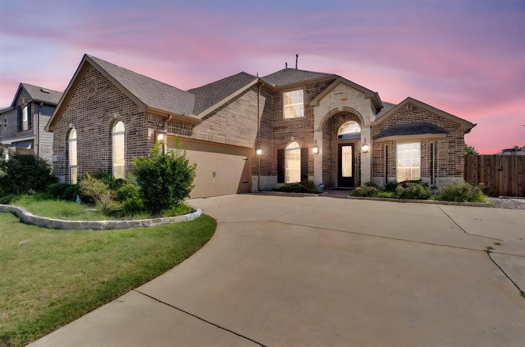 Situated on a spacious corner lot, this beautifully designed home offers an exceptional blend of elegance, comfort, and functionality. Manicured landscaping and strong curb appeal welcome you into a grand foyer with soaring two-story ceilings, abundant natural light, and refined architectural details including art niches and a sweeping staircase. The open-concept main living area features a dramatic floor-to-ceiling stone fireplace and oversized windows that frame views of the backyard, creating a seamless indoor-outdoor connection. The chef’s kitchen is thoughtfully designed for both daily living and entertaining, showcasing extensive cabinetry, granite countertops, stainless steel appliances, gas cooktop, double ovens, center island, and a dedicated coffee or prep nook. With five bedrooms and four full bathrooms, the home offers generous space for family, guests, or home office needs. An upstairs game room provides additional flexible living space ideal for media, recreation, or study. The backyard is a true highlight, designed for year-round enjoyment with a resort-style pool featuring stone accents and water features, along with an expansive outdoor living area complete with a built-in grill, bar, and multiple seating areas. The corner-lot layout provides added privacy, usability, and extra parking.

Combining a functional floor plan, abundant natural light, elegant finishes, and a resort-inspired outdoor retreat, this home delivers an exceptional North Texas living experience