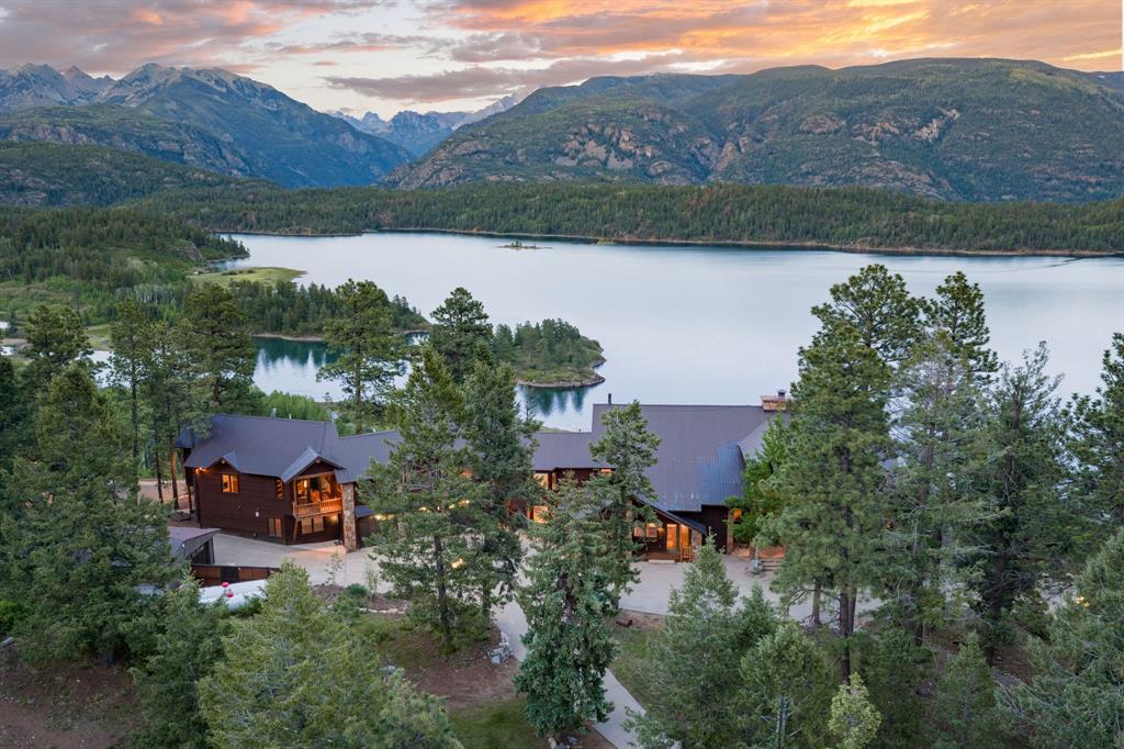 Legacy, Location, Land, Luxury, and Lifestyle encompasses the Spicerrosa Electra Estate. Perched high above Electra Lake on a dramatic and completely private alpine bluff, this Estate represents one of the most extraordinary legacy mountain properties in Southwest Colorado. Set on9.29 secluded acres with direct access into San Juan National Forest and located within coveted Colorado Game Management Unit 74, this estate lives infinitely larger than its acreage, offering an unmatched gateway to hundreds of thousands of acres of protected wilderness, recreation, and big-game habitat. From nearly every room and outdoor living space, the estate captures commanding panoramic views stretching across Electra Lake and the iconic peaks of the San Juan Mountains. The setting is exceptionally rare — private, protected, and impossible to replicate — creating a true sense of being immersed in the mountains while remaining conveniently close to both Purgatory Resort and The Glacier Club.