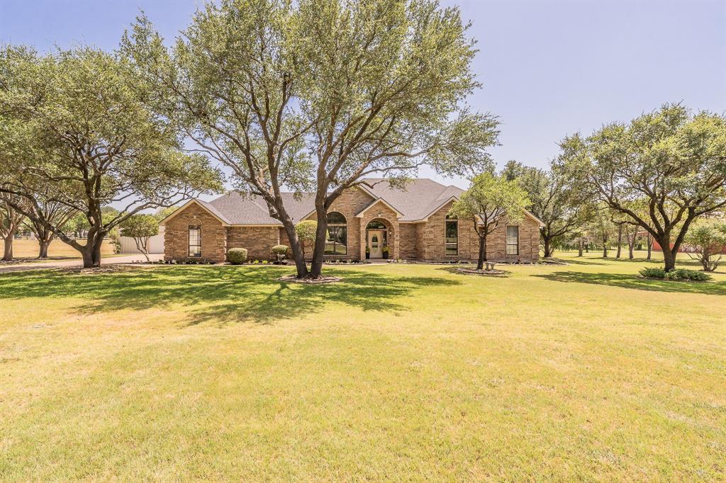 Custom-built, single-owner, and meticulously maintained, this exceptional 4-bedroom, 3-bath home sits on 2.6 beautiful acres in Crowley ISD with **no HOA and no city taxes**. Designed for comfortable living, the spacious floor plan features an oversized living room with a cozy wood-burning fireplace, a large utility room with space for an upright freezer or second refrigerator, and a thoughtfully designed 3-car garage with a separated third bay that's perfect for lawn equipment, seasonal décor, or additional storage. The impressive 30' x 30' workshop provides endless possibilities for hobbies, projects, or a home business. Relax on the covered back patio and enjoy peaceful country views in one of Crowley's most picturesque rural settings. Experience the privacy and freedom of country living while remaining just minutes from shopping, dining, and major highways. A rare opportunity to own a quality-built home that has been lovingly cared for by its original owner.