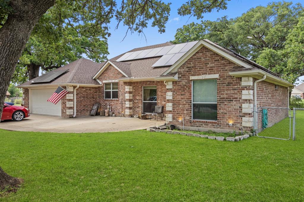 Country living at its finest! Nestled on nearly half an acre in Quinlan, TX, this charming brick-and-stone home offers space, serenity, and shade from beautiful mature trees. Enjoy the oversized lot, complete with extra parking, a storage building, and a massive deck perfect for relaxing or entertaining. Inside, you’ll find a large, open kitchen with a breakfast bar that flows seamlessly into the living space—ideal for gatherings and everyday living. Whether you're looking for peaceful privacy or room to grow, this property delivers the best of country comfort just minutes from town conveniences.
