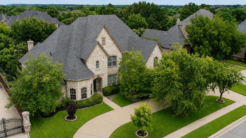 Welcome to this exceptional Michael Browning custom estate in the Warwick Parc community of Colleyville. Situated on nearly half an acre and offering over 5,000 square feet of thoughtfully designed living space, this home combines timeless architecture, extensive recent updates, and a resort-style backyard.

The spacious floor plan features 5 bedrooms, 5.5 bathrooms, a dedicated executive office with custom built-in millwork, a game room with wet bar, media room, multipurpose flex room, and a 4-car garage. Rich architectural details are showcased throughout, including custom woodwork, restored interior finishes, soaring ceilings, multiple fireplaces, and extensive built-in cabinetry.

The kitchen is equipped with Thermador appliances including double ovens, built-in refrigerator, cooktop with grill and griddle, wine storage, abundant cabinetry, and generous preparation space designed for both everyday living and entertaining.

The primary suite offers a private fireplace, spa-inspired bath with jetted tub and body-spray shower, oversized custom closet, and direct access to the backyard spa.

Step outside to an outdoor retreat. The extensively renovated saltwater pool and elevated spa feature updated pebble finish, tile, lighting, equipment, water features, and custom stonework. Additional highlights include a covered patio with outdoor fireplace, built-in gas grill, outdoor television, mature landscaping, lush lawn, established vegetable garden, fruit trees, and multiple entertaining areas designed for relaxation and entertaining.

Additional features include three HVAC systems, four fireplaces, whole-home audio, wired networking, security system, custom closet systems throughout, abundant storage, and a new architectural roof installed in 2025.

One of Michael Browning's custom designs, this meticulously maintained home offers exceptional indoor and outdoor living in the heart of Colleyville.