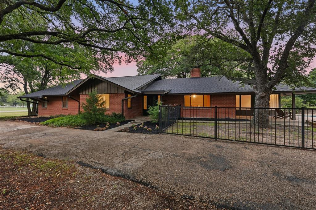 OPEN HOUSE Saturday, July 4 12pm-2pm and Sunday, July 5th 5pm-7pm...Tucked beneath a canopy of mature trees on nearly 2 private acres in one of Flower Mound’s most coveted settings, this rare corner-lot property delivers the kind of privacy, character, and lifestyle that buyers search for but rarely find. With a winding U-shaped driveway, towering trees, expansive green space, and an 8' deep sparkling pool, 3694 Green Meadow Lane feels like a private retreat just minutes from Grapevine Lake, shopping, dining, parks, and major commuter routes throughout DFW.

This spacious one-story home offers over 2,800 square feet with a flexible layout designed to fit a variety of lifestyles. Featuring either 3 bedrooms plus a flex room and sunroom, or functioning easily as a 4-bedroom home with a sunroom, the floorplan provides versatility for guests, a home office, fitness space, playroom, or additional living area. Oversized rooms, abundant storage, and a double-sided wood-burning fireplace create warmth and inviting gathering spaces throughout the home.

The combination of interior character and extraordinary outdoor space creates an opportunity that is increasingly hard to find in Flower Mound. Whether you envision quiet mornings surrounded by nature, entertaining poolside with friends and family, hosting holiday gatherings, or simply enjoying the peaceful setting under the Texas trees, this property was built for making memories.

The traditional design offers timeless appeal while also giving future owners the ability to personalize spaces over time if desired. A 3-car garage, separate workshop space ideal for hobbies, projects, storage, or creative use, extended parking, mature landscaping, and nearly 2 acres of usable land add to the property’s rare functionality and long-term value.

Properties with this combination of acreage, mature trees, privacy, pool, flexible living space, and prime Flower Mound location near the lake rarely become available.