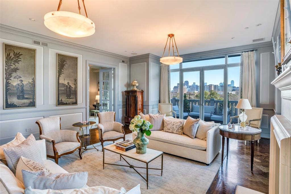 Beautifully reimagined by Lyn Muse Interiors, this extraordinary residence offers the finest in Dallas high-rise living. Stunning custom millwork, rich herringbone hardwood floors, Jeffries wall coverings, and a dramatic marble entry with direct elevator access set the stage, complemented by floor-to-ceiling windows showcasing sweeping views of downtown Dallas and Turtle Creek Park. The formal living room features a striking natural stone fireplace. Two large private terraces offer wonderful additional space to entertain. 

The sun-filled breakfast room opens to a designer gourmet kitchen appointed with luxury appliances, a wine refrigerator, and access to its own private terrace. The spacious primary suite features dual marble baths features Waterworks and Dornbracht plumbing fixtures and custom walk-in closets. French doors lead to a lovely study with an ensuite bath that can easily function as a third bedroom. A separate guest suite offers a private bath and a spacious walk-in closet.

Three reserved parking spaces (#196, #197, #304). Residents enjoy all amenities at The Vendome, including 24-hour valet and concierge service, a resort-style pool and cabanas, fitness center, owner’s library, L’Orangerie event room, three guest suites, dog park, and controlled building access.