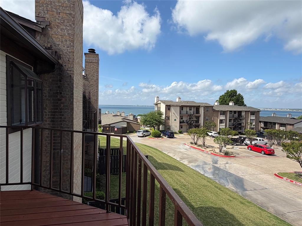 Delightful Condo Tastefully Updated. Entertaining Will Be a Dream. Large Open Living Area with Massive Granite Breakfast Bar. Plantation Shutters. Wall of Windows Extends Your Living to Balcony. Enjoy Sunsets, Sailboats and A View of Dallas Skyline in the Distance. You Will Be Cozy in the Winter with Your Wood Burning Fireplace. Primary Suite Windows with View of the Lake. Master Bath with Box Window. Want to Relax? Spyglass Hill Enjoys a View of Lake Ray Hubbard and Chandlers Landing Marina. Recent Updates: Roof by HOA 2023, HVAC 2023. Spyglass Hill Monthly HOA $291. Covers Roof and Lawn Maintenance. Excellent Schools: Pullen – Cain – Heath High School.