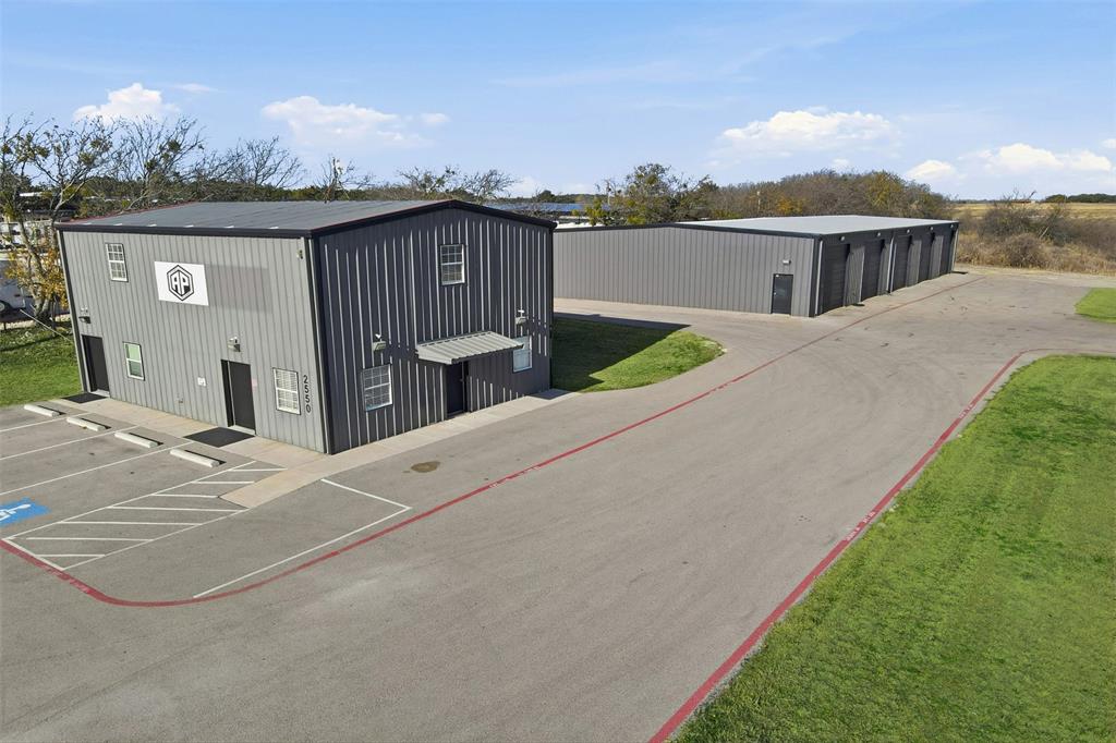 Prime commercial opportunity on US Highway 377 offering exceptional visibility, strong traffic counts, and approximately 2.8 acres in one of Granbury's most active commercial corridors. Designed for flexibility, the property features approximately 7,400 square feet under roof, including a climate controlled and insulated warehouse-shop, dedicated office space, and a full upstairs living quarters or executive suite, creating an ideal setup for owner users, business operators, or companies seeking a combined office, warehouse, and headquarters location.
The property is well suited for contractors, construction companies, service businesses, fleet operations, distribution, manufacturing, automotive, equipment sales, and industrial flex users requiring secure yard space, warehouse capacity, and room for future growth. Ample space for fleet parking, equipment storage, outdoor laydown, and future expansion provides functionality that is increasingly difficult to find along the Highway 377 corridor.
Strategically located just minutes from the expanding Granbury Regional Airport, the property also benefits from continued commercial investment, new residential development, expanding business activity, and ongoing regional infrastructure improvements along US Highway 377. Its central location provides convenient access to Granbury, Cresson, Tolar, Weatherford, Glen Rose, and the greater Fort Worth market, making it an excellent choice for businesses serving customers throughout North Central Texas.
Whether you're relocating, expanding operations, establishing a regional headquarters, or acquiring a long term commercial investment, this property offers outstanding visibility, accessibility, and versatility in one of North Texas' fastest growing markets.