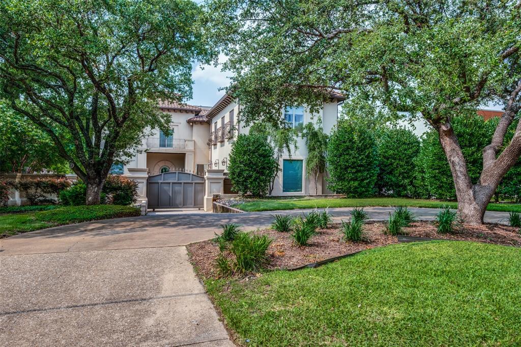 Indulge in luxury with this regal Mediterranean-inspired home blending contemporary interiors with resort-style elegance. Honed marble surfaces and clean lines create a gallery-like atmosphere, perfect for art and car enthusiasts. Lush grounds feature a veranda, negative-edge pool, and gated motor court for privacy. Soaring ceilings greet you in the foyer, leading to a music room for intimate gatherings. The primary bedroom offers comfort and luxury, with a flexible sitting room or office space, huge closet and balcony. Elevator-ready, with a secondary primary bedroom and a cinema room padded in suede walls ideal for entertainment. Experience high style and craftsmanship in this exquisite residence.
