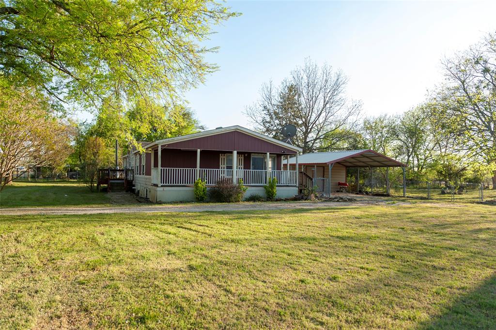 A versatile multi-home property perfect for multi-generational living, rental income, or a spacious homestead with room to grow. Sitting on a .75-acre lot, this property features a charming 2-bedroom main home PLUS a 4-bedroom mobile home functioning as a full accessory dwelling unit, giving you unmatched flexibility and value.

This mobile home is 1560 sq ft, 4-bedroom, 2-bathroom, 2014 mobile home with abundant storage, a kitchenette, and sliding glass doors leading to its own attached covered wooden deck. Updates include LVP flooring (2019) in main areas with carpet in the bedrooms, upgraded kitchen appliances (2021), and a new 2022 washing machine, dryer, and industrial stand-up freezer. The primary bathroom features a relaxing garden tub and walk-in shower. With four bedrooms, modern updates, and generous storage space.
The cottage on the property offers cozy comfort and classic Texas charm. This 1,200-sq-ft, 2-bedroom home includes thoughtful updates such as a new HVAC system and water heater (2019). The main living areas feature LVP flooring installed five years ago, while the bedrooms retain soft carpet. A covered wooden deck off the back creates the perfect spot for morning coffee or evening stargazing. A 2-car carport sits conveniently at the front steps makes this a perfect in-law suite for generational living, or even a rental income.

The property also includes two 2-car carports and two storage sheds, providing ample parking and space for tools, equipment, or hobbies.