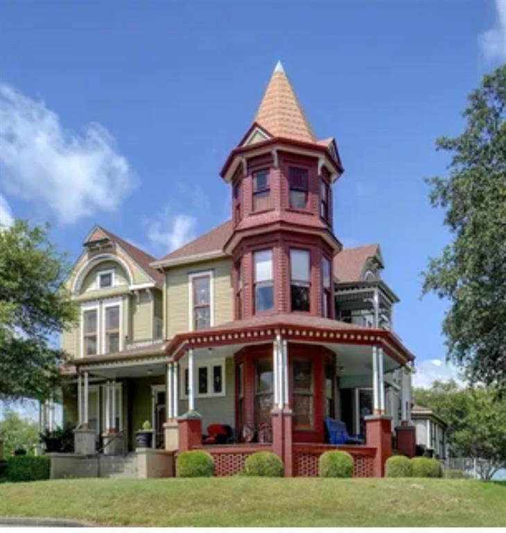 Here is a once in a lifetime chance to own a 130 year old true Victorian Home, on 3.1 acres for your business. This beauty is zoned for light commercial including Law office, wedding venue, event venue, tea house, Doctor or Dentist offices, Title Co, Mtg co, jeweler, bakery, landscaping, doggy daycare, children daycare, small private school, bakery, restaurant, retail, Bed and Breakfast, small hotel and so much more.  This Victorian is currently used as a well established Bed and Breakfast, however, owner is not selling business. This home is historical, very well known, and NOT considered a historical home because it is not located in the historic home district, nor a landmark. The owner has maintained its originality. Could possibly be turned into a landmark home with the possibilities of grants to maintain, but would be up to new owner to do so.  A total of 10 bedrooms or offices, 2 patio areas with 2 hot tubs, dining room that seats 18, another dining or meeting area, large living, seating area, original wood throughout, 10 bathrooms, basement, and an attic area which could possibly gain up to 2000sqft. Property has a large basement.  Kitchen has a commercial dishwasher for turning over large crowds.  This property sits on 3.1 acres of open land that can be developed into an extension of any business.  2 streets to access property.  Possibilities are endless. Shows to be C1 zoning.  Property can be torn down per city for land use.  Buyer and buyer agents to do their due diligence on zoning, future development, taxes, sqft, title, and everything associated with this property.
