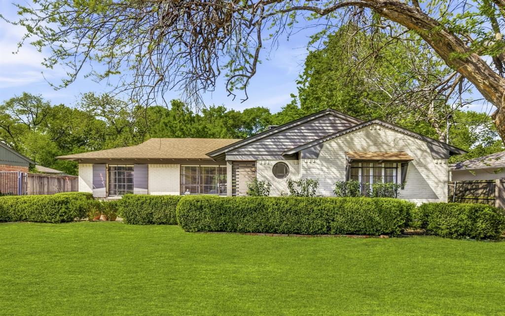 California Ranch style home on one of the most coveted lots in Ridgewood Park — a true creek lot with an oversized, deeply private backyard that is simply rare gem for the neighborhood. Mature trees, a sparkling pool and exterior lighting create an outdoor living experience that feels more like a Hill Country retreat than an East Dallas address. The natural creek buffer beyond the property line means no rear neighbors and a level of seclusion that discerning homeowners have learned not to take for granted. Inside, 1,896 SF of warm, well-proportioned living space delivers two bedrooms, two updated bathrooms, a dedicated study and a bonus sunroom off the primary suite. Light hardwood floors run throughout, the kitchen opens to the main living areas and floor-to-ceiling windows bathe every room in natural light. The home is fully updated and move-in ready — or bring your vision and elevate an already beautiful canvas. The detached two-car garage is a standout feature: two full walls of glass doors transform the space into a natural studio, creative workspace, gym or flex entertaining area. Zoned to Rogers Elementary, Benjamin Franklin International Exploratory Academy and Woodrow Wilson High School — one of Dallas ISD's marquee feeder patterns and a consistent driver of demand in this neighborhood. Minutes to White Rock Lake trails, the Dallas Arboretum, Lakewood Shopping Center and the dining corridors of Lower Greenville and Abrams Road. Less than seven miles to Downtown Dallas, Love Field, Preston Center and so much more.