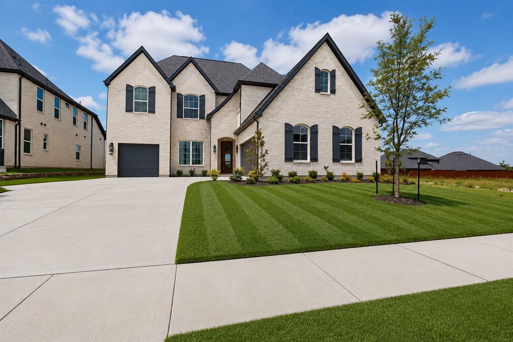 Move-In Ready! This exceptional Shamrock Homes residence offers an impressive layout featuring 5 bathrooms, a private study, formal dining room, dedicated media room, and a spacious 3-car garage. Gently lived in by its original owners for only two months, this home presents like new and offers a rare opportunity to enjoy nearly brand-new construction without the wait. The remaining builder's warranty is transferable, providing added peace of mind for the next owner.
A grand entry highlighted by a stunning spiral staircase welcomes you inside. The expansive family room with soaring cathedral ceilings creates an inviting atmosphere and flows seamlessly into the gourmet kitchen, complete with a casual dining area and cozy window seat.
Designed with comfort and functionality in mind, three of the four secondary bedrooms feature private en-suite baths, providing added privacy for family members and guests. The spacious primary retreat offers a beautifully appointed bath and generous walk-in closet, creating a relaxing owner's sanctuary.
Additional highlights include a Texas-sized media room, convenient powder bath, designer lighting, and beautiful wood flooring throughout the main living areas. Located in a vibrant community with low HOA dues and favorable tax rates, this home offers the perfect blend of elegance, comfort, and everyday living.  Living in The Homestead means resort style amenities right outside your door, which includes a pool with tanning deck and cabanas, splash pad, dog park, and trails winding through lush greenbelts with 50 acres of dedicated parkland. Just 30 minutes northeast of Dallas, you're minutes from The Harbor Rockwall, Lake Ray Hubbard, and downtown Rockwall's live music scene. Zoned to the top-rated Rockwall ISD. This one is the total package. Schedule your tour today! Discounted rate options and no lender fee future refinancing may be available for qualified buyers of this home.