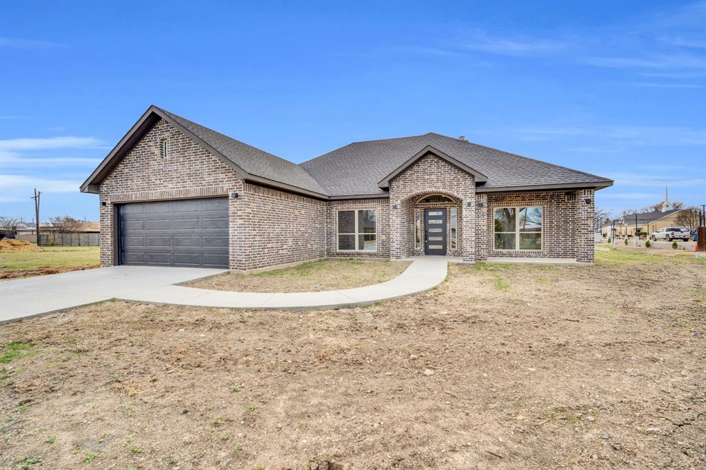 Newly constructed beautiful brick home with modern style flair.. This spacious 4 bedroom 2 bath home has exactly what your looking for.  First room to the left could be your office space or a 4th bedroom... big beautiful windows looking out to the front.. A spacious living area with a wood burning fireplace encased in tile that gives this living room the warmth is needs. The kitchen has plenty of cabinet space with granite counter tops, a nice size pantry with beautiful modern style lighting over the bar and eating area. The kitchen will host a stove, dishwasher and microwave.  The guest bathroom has plenty of space.. has a tube, shower combo with rain style shower head. Nice modern fixtures throughout.  All bedrooms have large closet space and ceiling fans. The primary bedroom and ensuite bath host a double vanity sinks, beautiful granite countertops, large tile shower with rain shower head and spray wand.  Nice walk-in custom closet. The ensuite even has room for you to add your favorite vanity or dresser. Nicely covered porches front and back.  Come enjoy the convenience of small town living!