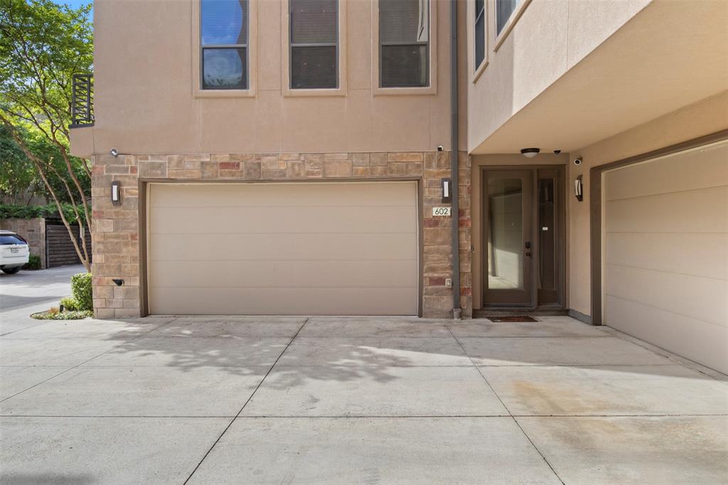 Modern luxury meets prime location in this centrally located contemporary townhome, just minutes from Downtown, Uptown, Lower Greenville, the Arts District, and Deep Ellum.
This thoughtfully designed home features 2 spacious bedrooms with en-suite baths and walk-in closets on the third floor, plus a versatile first-floor bedroom or office with a half bath, ideal for guests or remote work.
The second level offers an open-concept layout perfect for entertaining, highlighted by 9-foot ceilings, commercial-grade engineered wood flooring, and a home wired for surround sound with integrated speakers. The chef’s kitchen is equipped with Bosch and Bertazzoni stainless steel appliances, including a gas range, convection oven, vented hood, beverage refrigerator, and a large center island with ample storage and prep space.
The primary suite serves as a private retreat with a seating area, custom walk-in closet with built-in drawers, and an oversized shower featuring dual Speakman showerheads, including a rain feature. A secondary bedroom also includes its own en-suite bath and walk-in closet.
Enjoy multiple outdoor living options with three distinct spaces: a ground-level patio with a turfed, fenced yard; a second-floor terrace adjacent to the living area; and a spacious rooftop deck with panoramic views of the Downtown Dallas skyline and Fair Park.
Additional features include recessed LED lighting, central vacuum system, walk-in attic storage, Vivint home security system, and SmartLock access.
Located within a gated community offering guest parking and a dog park, this home delivers the perfect blend of style, functionality, and urban convenience.
Don’t miss your opportunity to experience elevated city living.