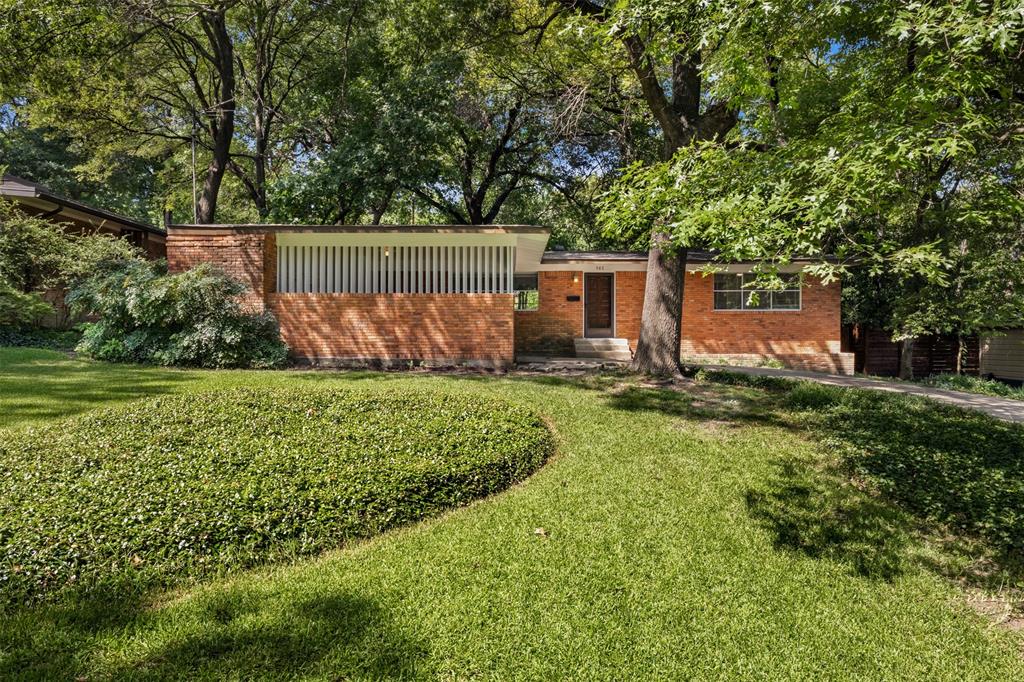 Fantastic mid-century modern home located on one of east Dallas' most enchanting streets. Welcome to 985 N Rustic Circle. Stunning drive-up appeal on this over a quarter of an acre lot, this circa 1954 home is in pristine condition making it move in ready, perfect for your individual updates or prime for a thoughtful addition. Featuring 3 bedrooms 2 full baths, 2 car carport and many quintessential MCM architectural details like clean lines, indirect lighting and walls of glass flooding the home with natural light. Many updates to the mechanical systems include HVAC, roof, and electrical. Also, features a fresh paint job inside and out and a full-size laundry room. Majestic trees create a canopy of shade providing the perfect spot for outdoor living. Short bike ride or walk to White Rock Lake and many local trendy restaurants and coffee shops. Located in the exemplary, newly constructed Hexter Elementary School zone.