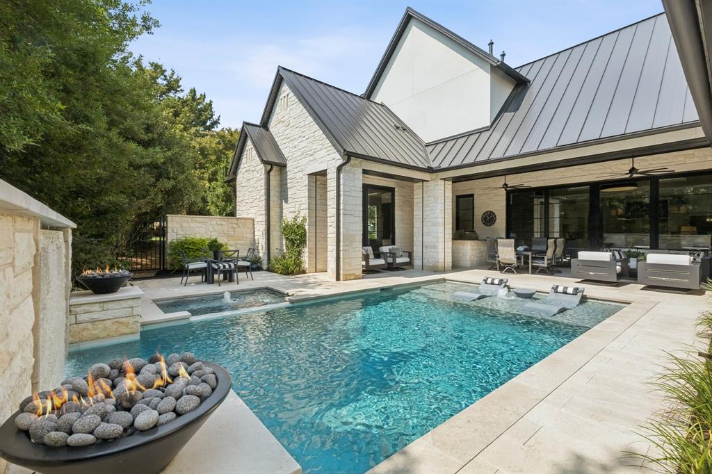 Welcome Home to this Soft Modern-Contemporary home, ready for immediate Move In! Almost new, this light and bright home sits in exclusive Vaquero of Westlake. The perfect floor plan for the entire family, this gorgeous home welcomes you with an impressive Foyer with stunning glass Wine Room perfect to display your personal collection. The Executive Office features scenic views to the front, boasts a wall of drawer storage and shelves, and also has a Safe Room-storm shelter. Enter the spacious Great Room with feature white oak focal architectural wall, beautiful fireplace for cozy evenings and sliding doors to the pool area. The sparkling Chef's Kitchen with tons of cabinets, oversized island, Subzero Freezer-Fridge, Wolfe appliances, quartz and quartzite countertops, pebble ice maker, hidden outlets, Miele coffee station, fantastic Prep Kitchen with abundant appliance workspace and storage.  The spacious Dining Room is ready for entertaining! Ready for a crown, the large Game Room with Wet Bar has space a media viewing area, plus Billiards, Mah Jong or a games table, all while overlooking the lovely pool area. The Primary Suite is your private retreat with fabulous pool and backyard views, beautiful Spa Bath with dual counters, spacious shower and 2 Oversized separate Closets. Private Guest Suite, Exercise Room and Mom's Office are also down. Upstairs boasts 3 oversized Bedroom with en-suite baths and a large Game Room for family fun. Step outside to a backyard Oasis complete with sparkling Watercrest pool with impressive water feature, spa and fire bowls, large covered patio with automated screens, plus a dedicated grill area. Fully Foam Encapsulated, Pivot Iron Entrance door, white oak wood floors, Lutron lighting system, motorized shades. Truly Move In Ready.   *** Priority Golf Membership to Vaquero Country Club available, upon Buyers' successful application and approval through the Membership process. ***